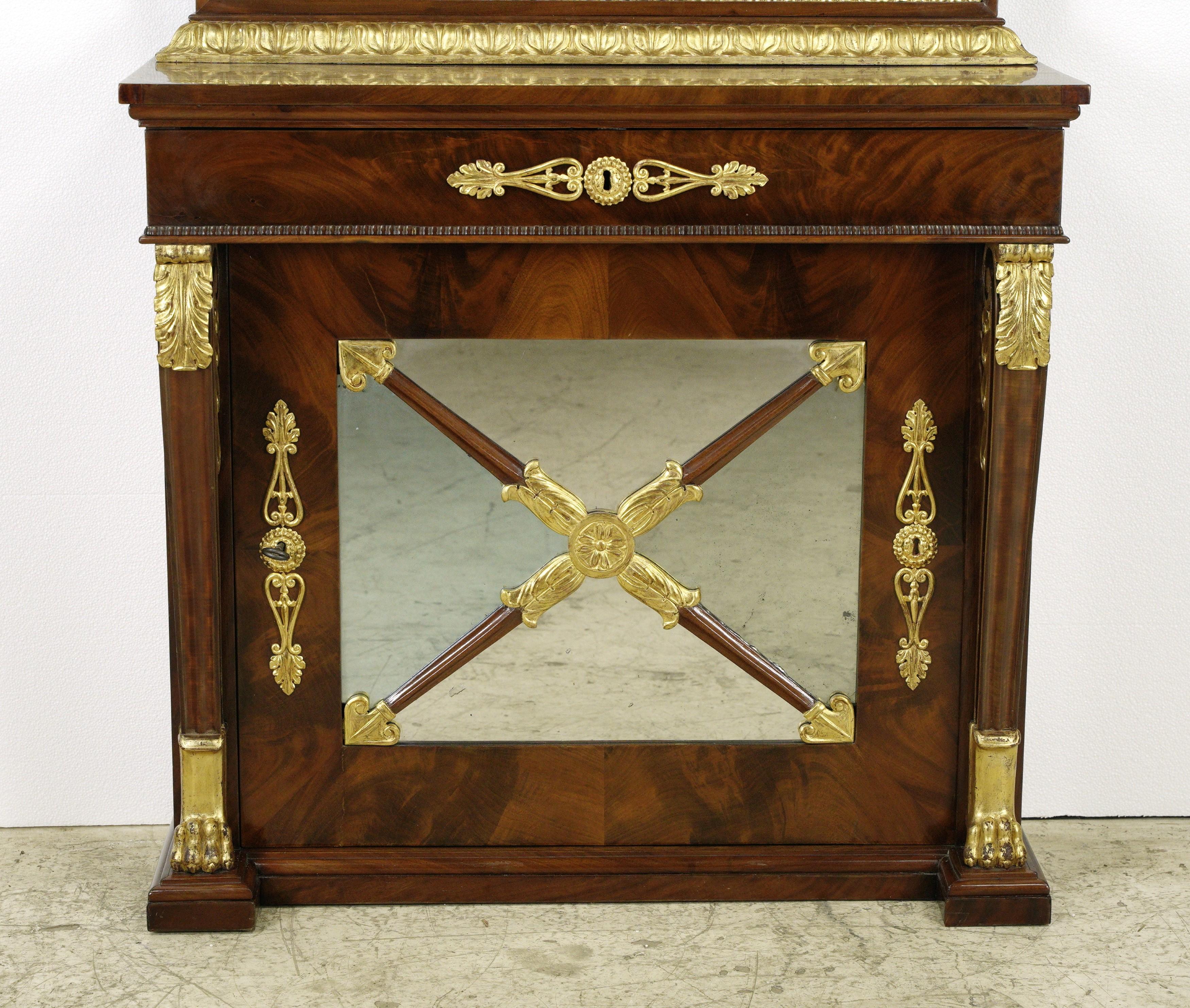 This timeless piece features a swing open cabinet and pull out drawer. The drawer and lower cabinet door are keyed for secure locking, complemented by one barreled skeleton key. This exclusive piece comes with one original key for both pier mirrors,
