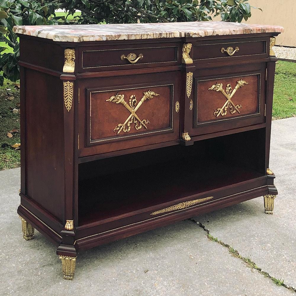 Antique French Empire mahogany marble top buffet with bronze is an exquisite example of fine French cabinetry, with the emphasis on the finest materials, design and craftsmanship! Exotic mahogany was used to form the casework which is a design that