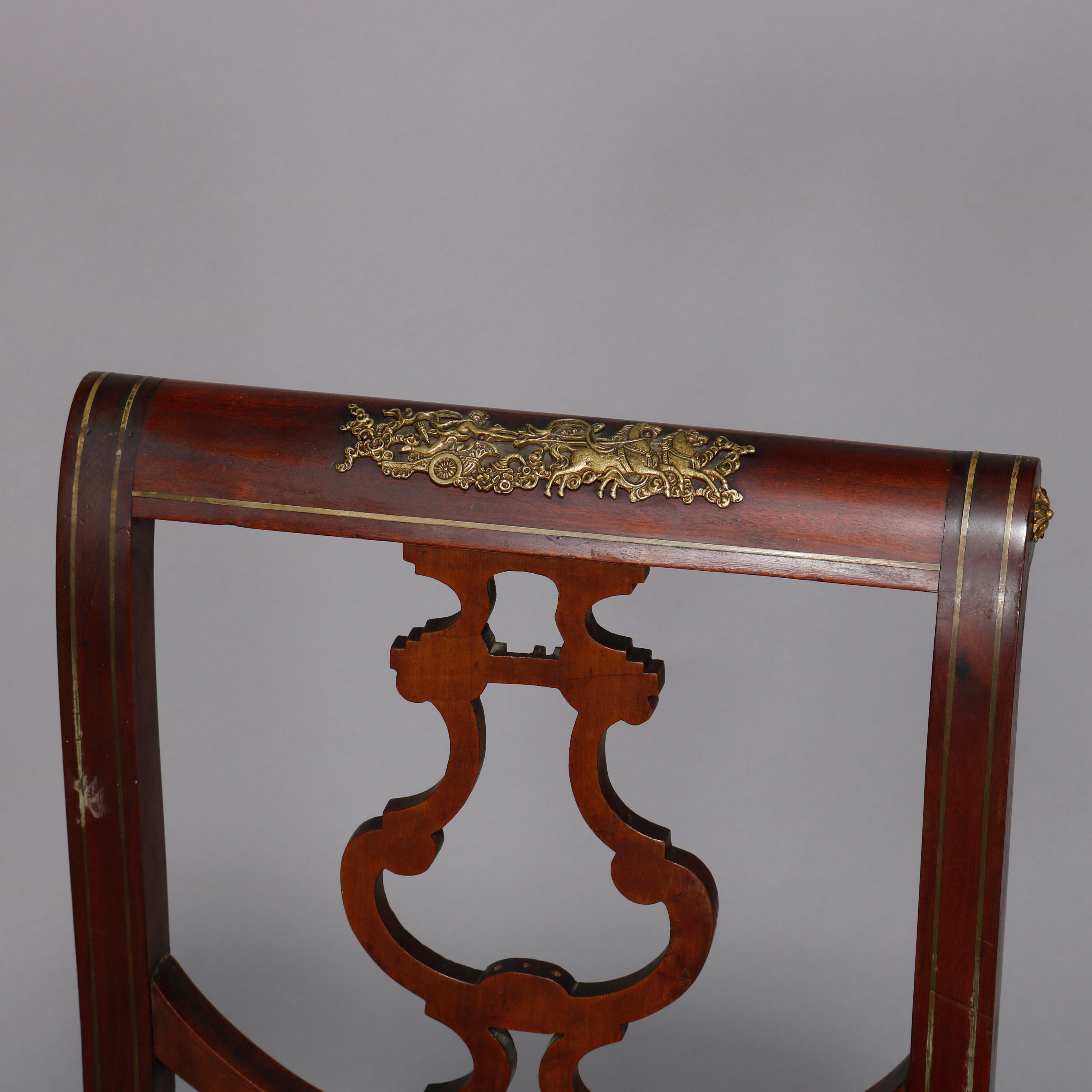 An antique French Empire side chair offers mahogany construction having stylized urn form back slat and foliate cast ormolu mounts throughout, 19th century

Measures - 35.75