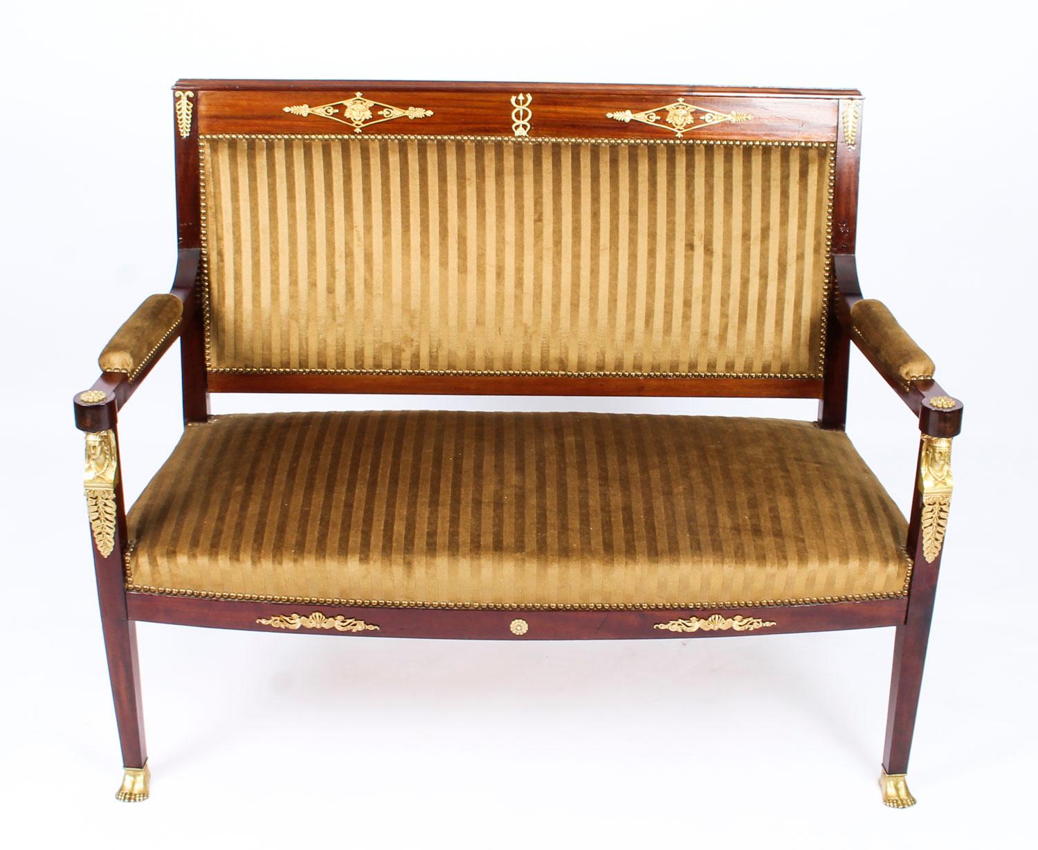 This is a fantastic and highly decorative antique French gilt bronze mounted Empire Revival sofa, circa 1880 in date.

Crafted from fabulous solid mahogany and smothered in fabulous high quality ormolu mounts reminiscent of the Empire style with