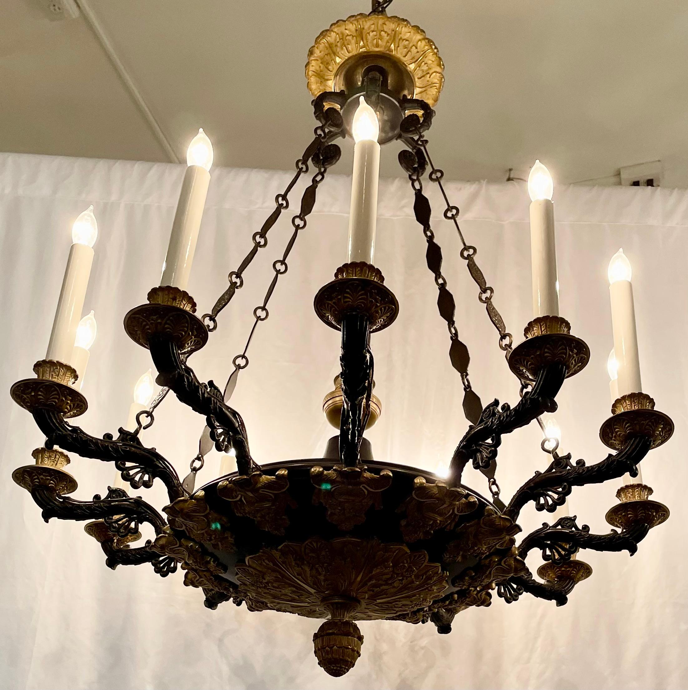 Antique French Empire Style Ormolu and Patinated Bronze 12 Light Chandelier, Circa 1890's.