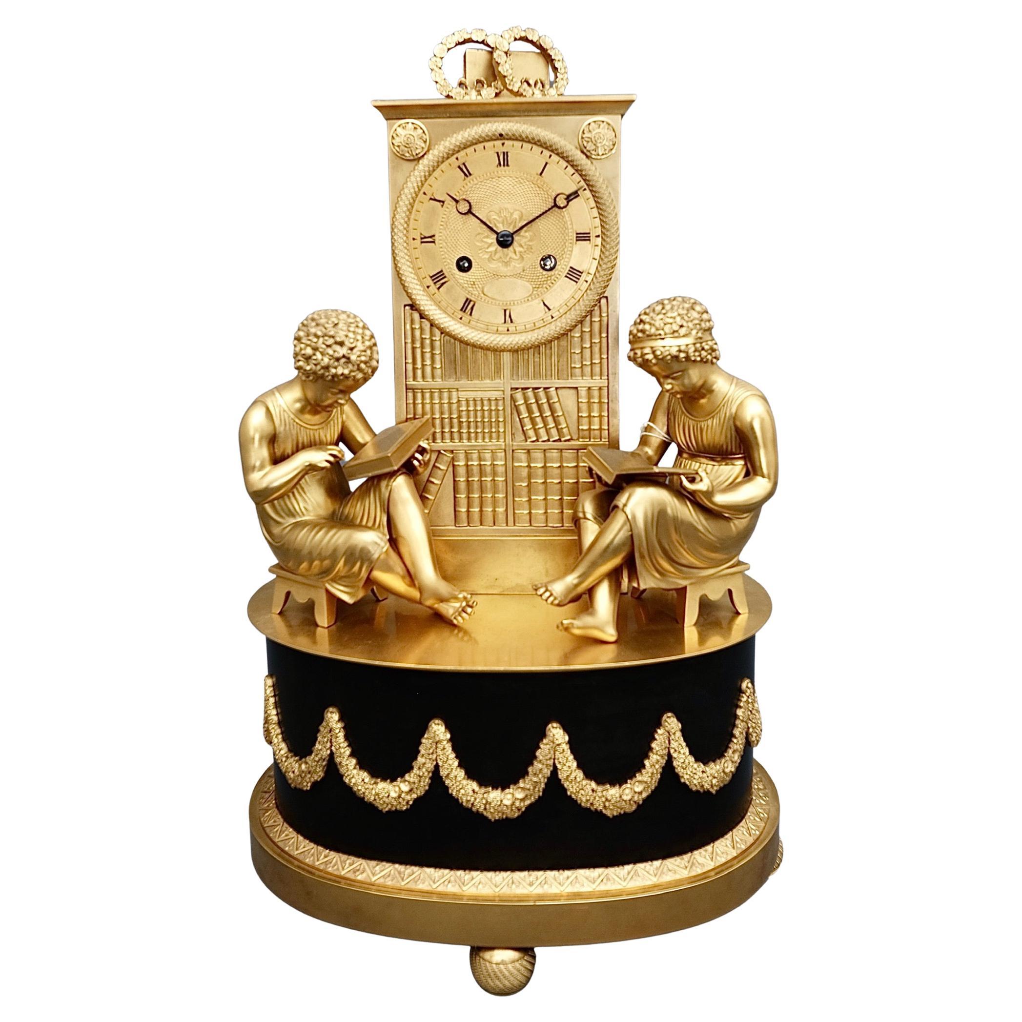 Ancienne horloge de bibliothèque Empire française en bronze doré