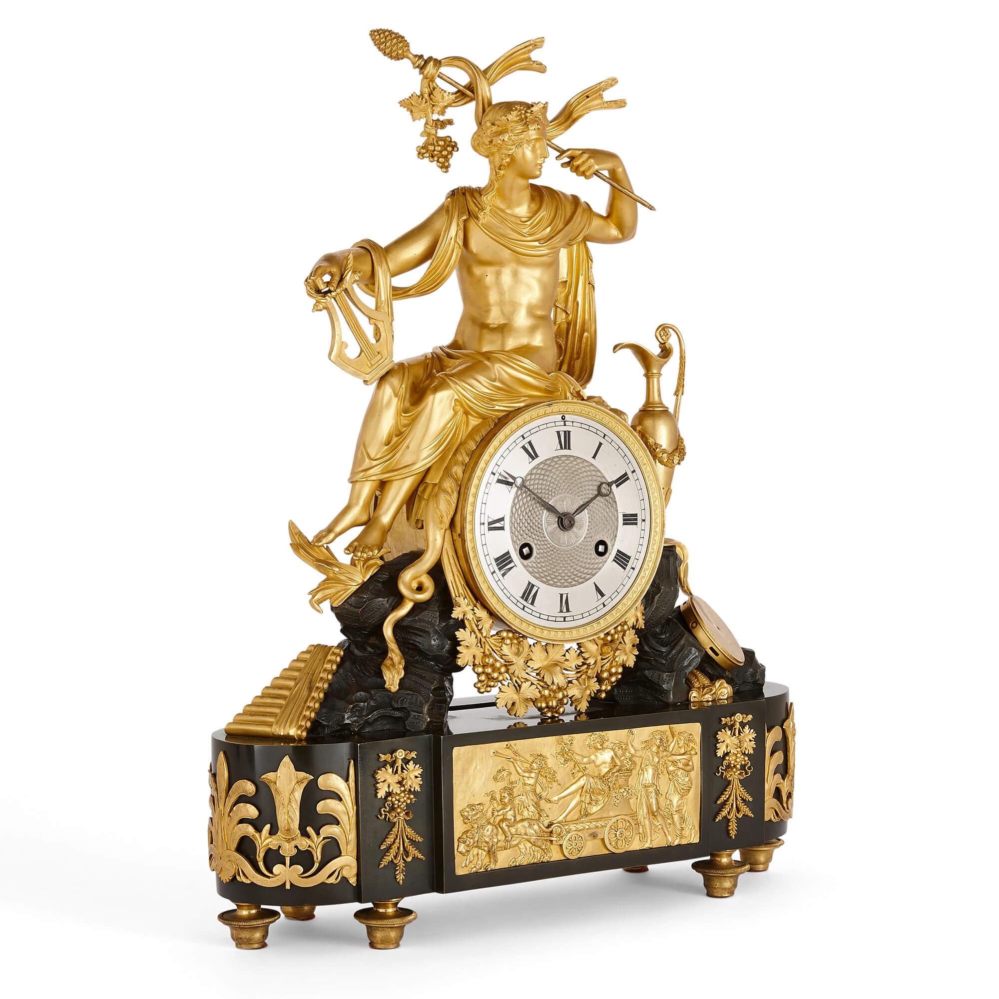Antique French Empire patinated and gilt bronze mantel clock
French, early 19th century
Measures: Height 55cm, width 43cm, depth 13cm

This fine Empire period mantel clock is wrought from patinated and gilt bronze. The clock features a large