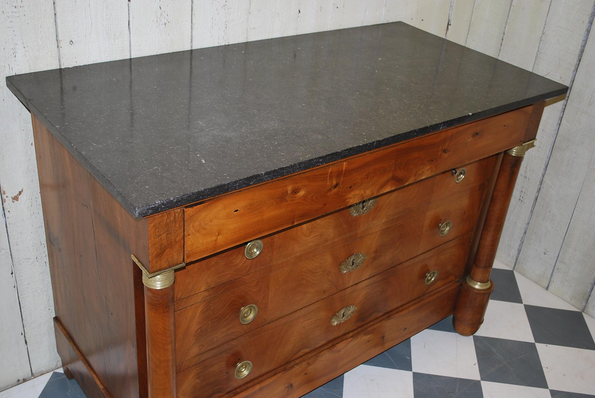 This is a beautifully made French commode or chest of drawers in excellent condition with original black marble top and ormolu mounts. Wonderful flamed walnut veneer to the drawer fronts and column corners. Made on a good solid oak carcass.

 
