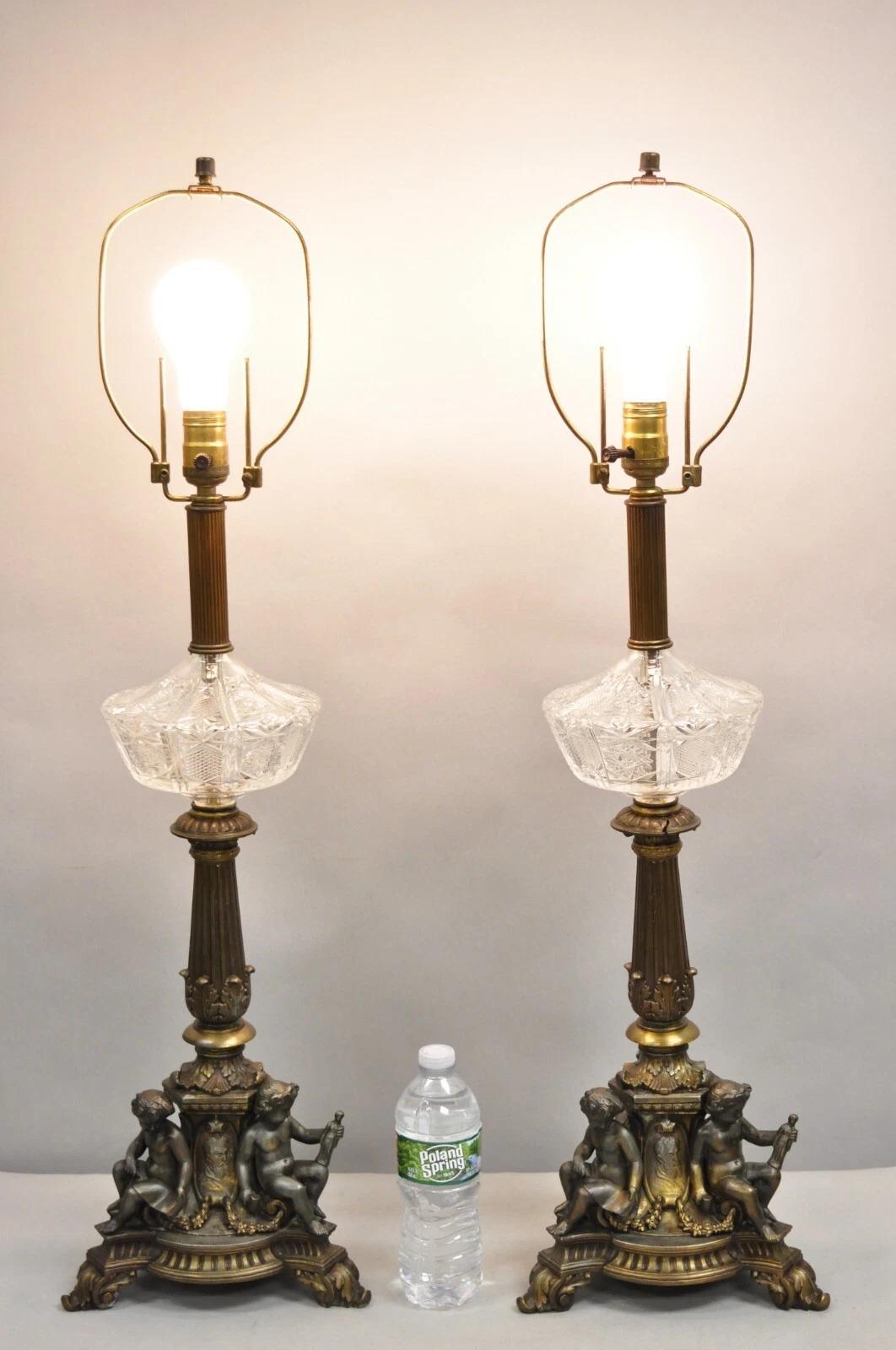 Antique French Empire Renaissance Revival Gilt Metal & Cut Glass Triple Cherub Table Lamps - a Pair. Circa Early 20th Century. Measurements: 34