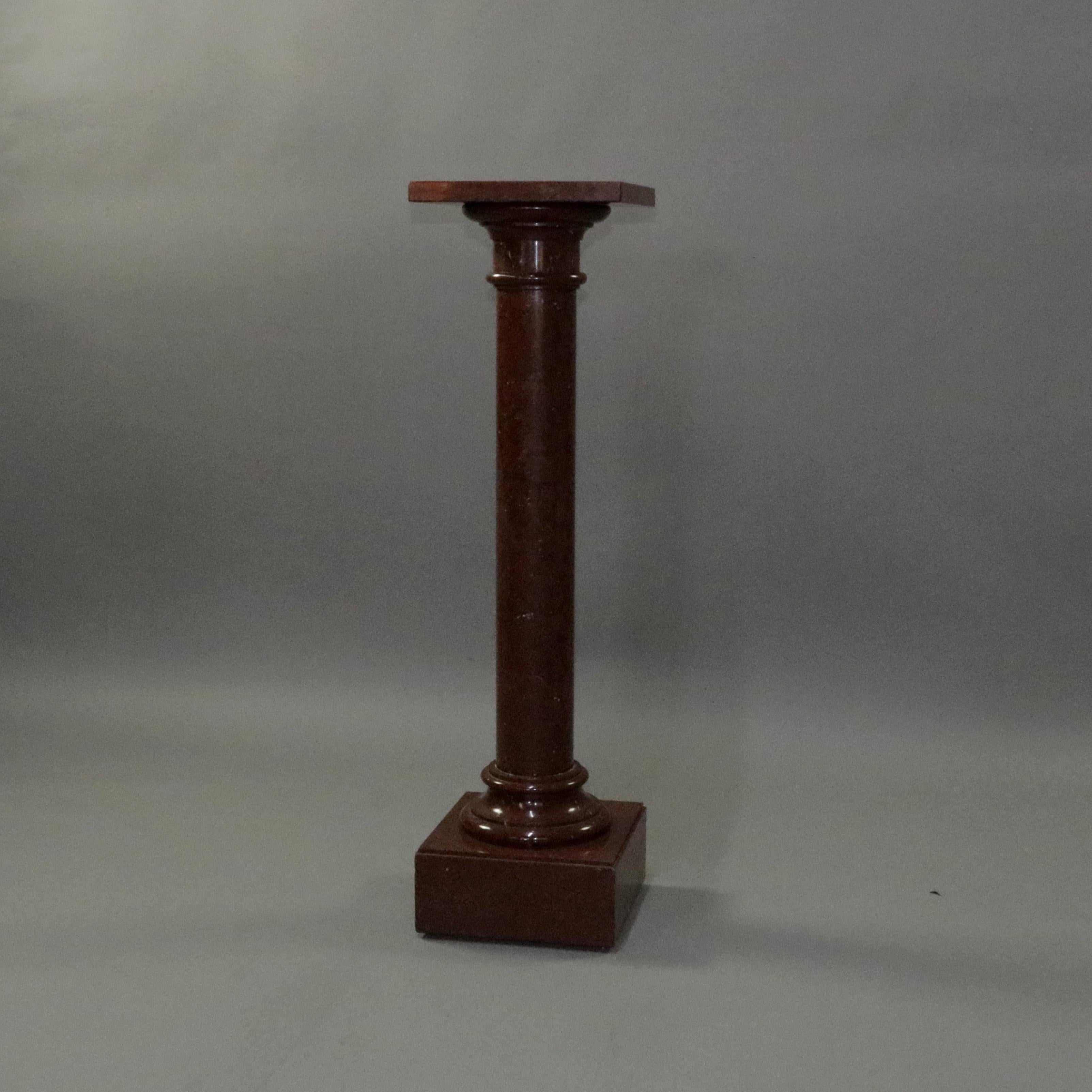 Antique French Empire rouge marble sculpture display pedestal features rouge marble construction in Corinthian column form having carved capital and stepped base, circa 1880

Measures: 44