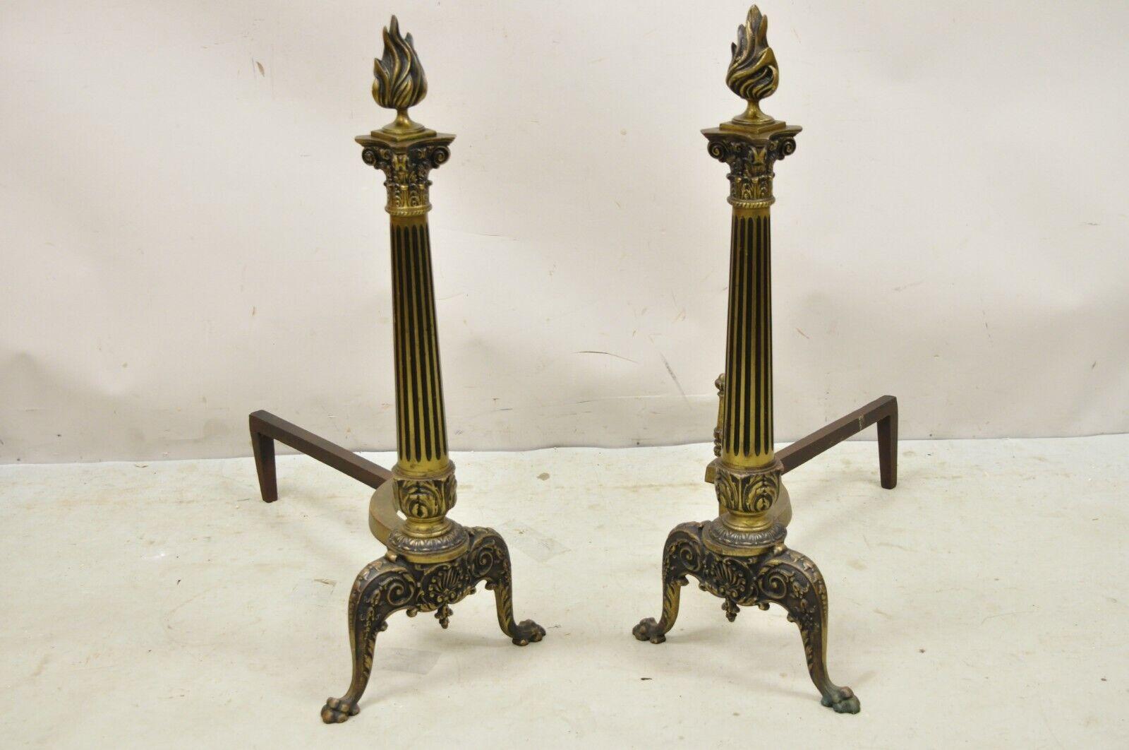 Antique French Empire Style Bronze Column Form Flame Finial Andirons - a Pair. Item features flame finials, reeded column form shafts, paw feet, very nice antique set. Circa Early 1900s. Measurements: 27.5