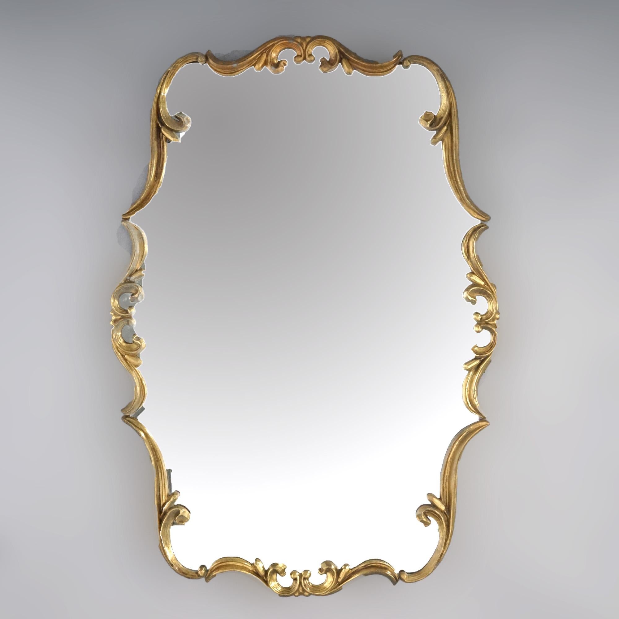 An antique French Empire style wall mirror offers bronzed metal scroll form frame, circa 1920

Measures - 44.25