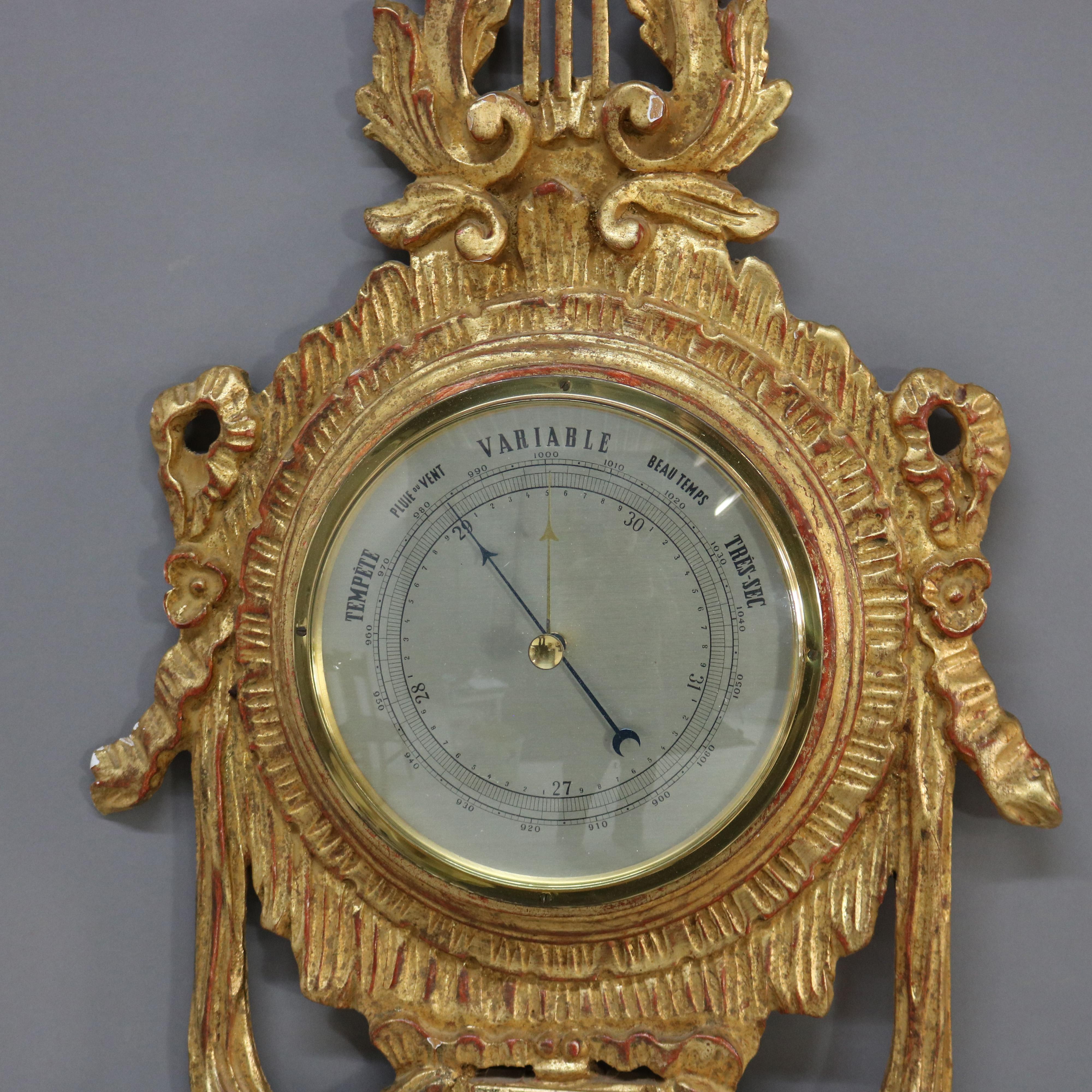 Antiguo Barómetro Francés Estilo Imperio de Madera Dorada Tallada, Firmado, C1930.   
39 1/4