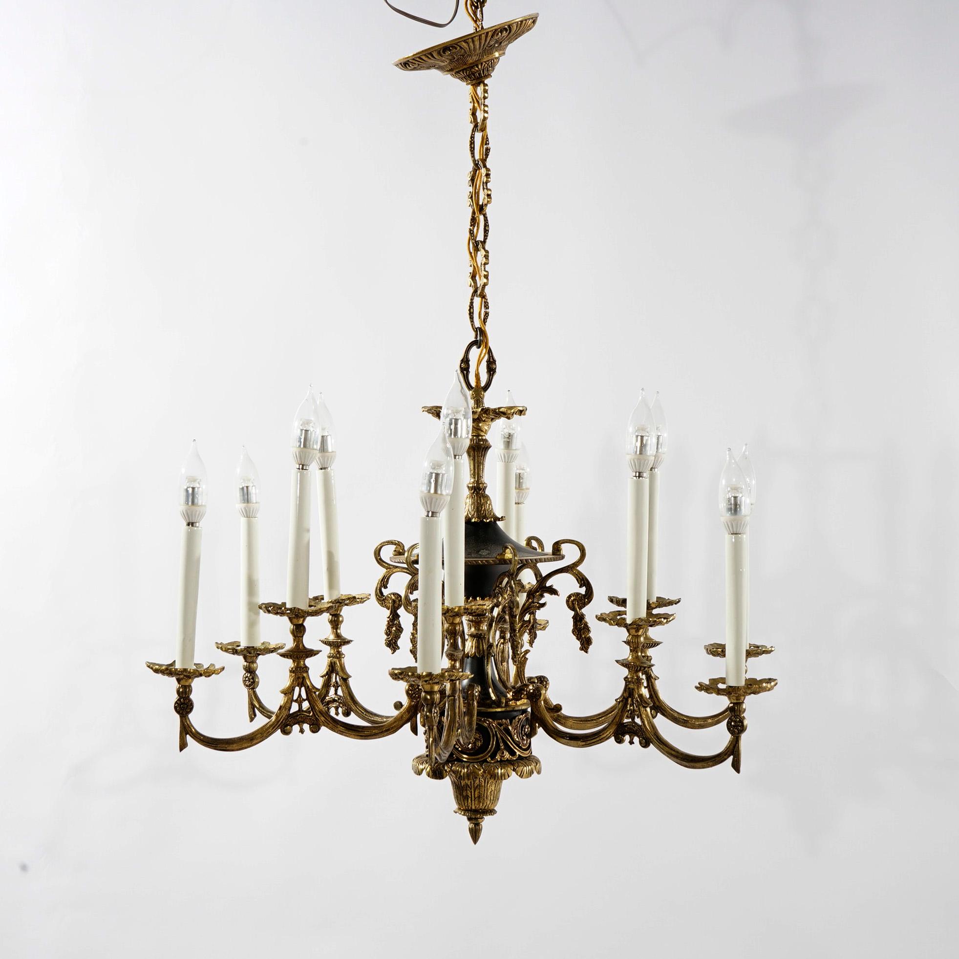 Américain Lustre ancien de style Empire français à douze lumières en bronze ébénisé, début du XXe siècle en vente