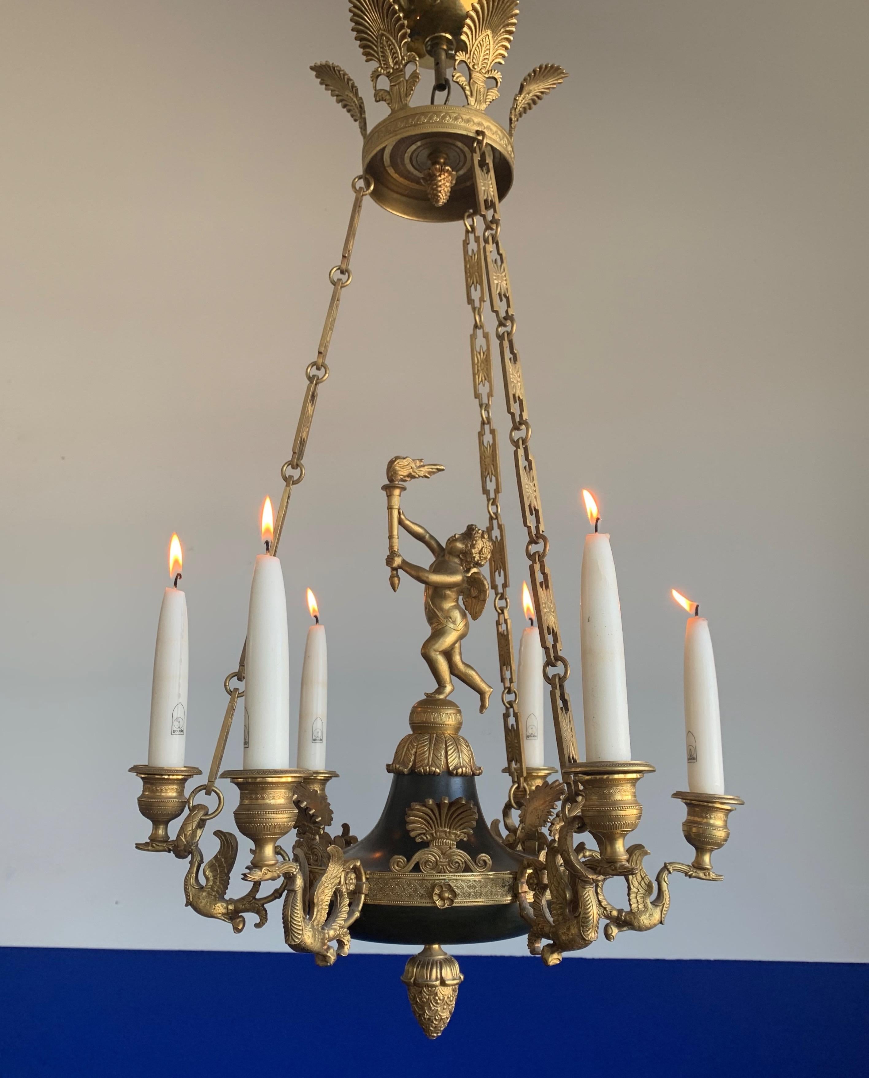 Stunning and small six light chandelier with gilt bronze cherub and swan sculptures. 

This top quality made, 19th century candle pendant or small chandelier could be perfect for you. Both on and off this quality antique can create just the right