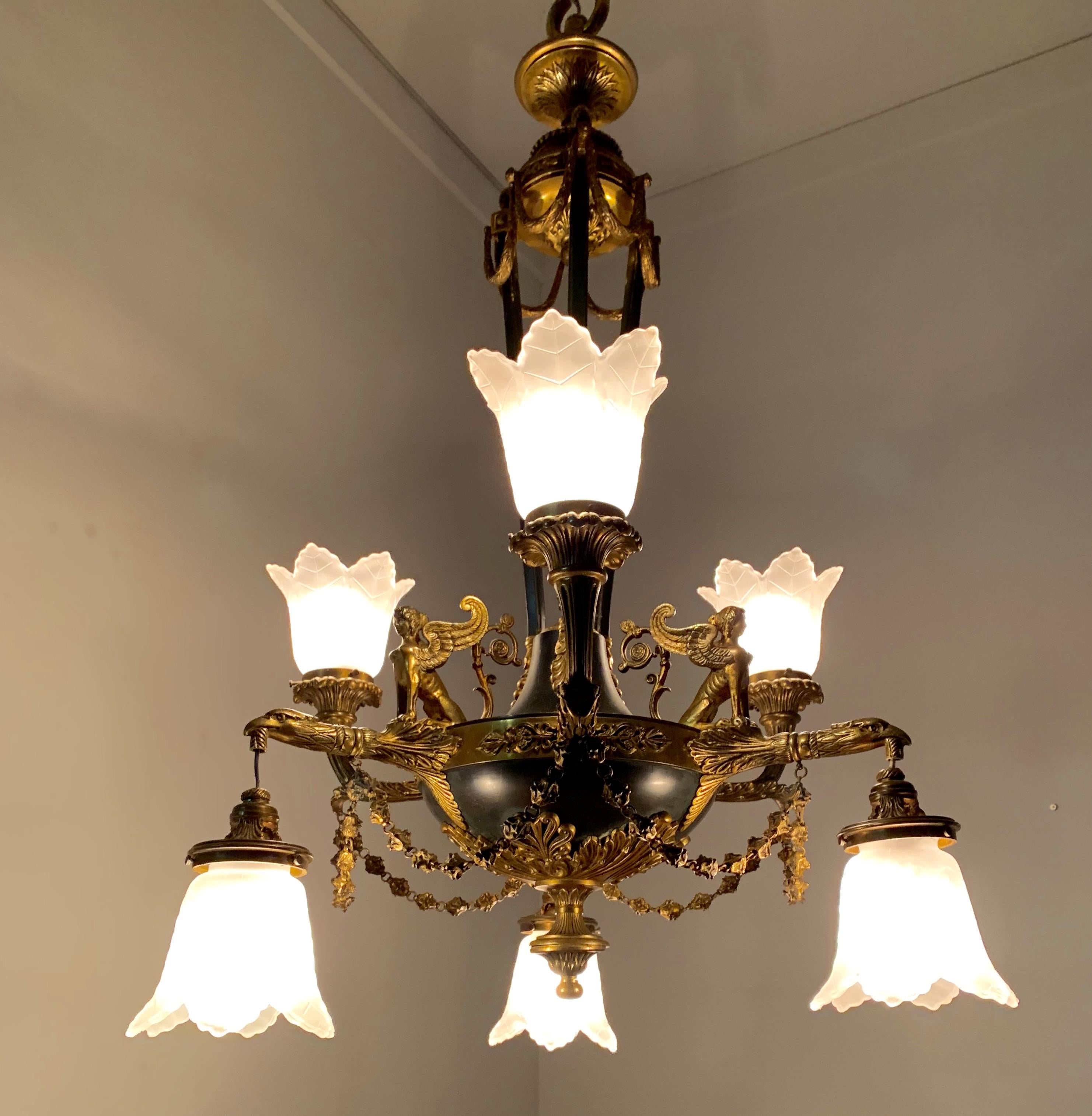 Stunning and large six-light chandelier with glass shades.

This top quality pendant light from the early 1900s is another one of our recent great finds. Both with the light switched on and off this quality antique can create just the right