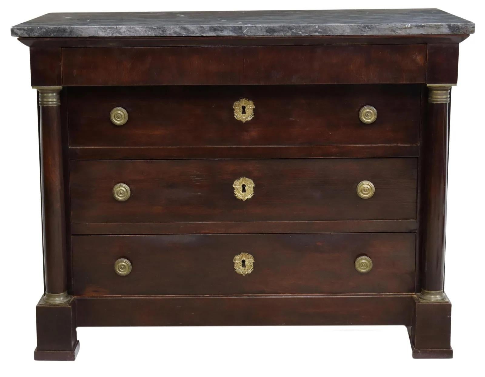 French Empire style mahogany commode, 19th c., having marble top, frieze drawer, over three additional drawers, flanked by turned columnar supports, rising on block feet.

Dimensions: approx 35