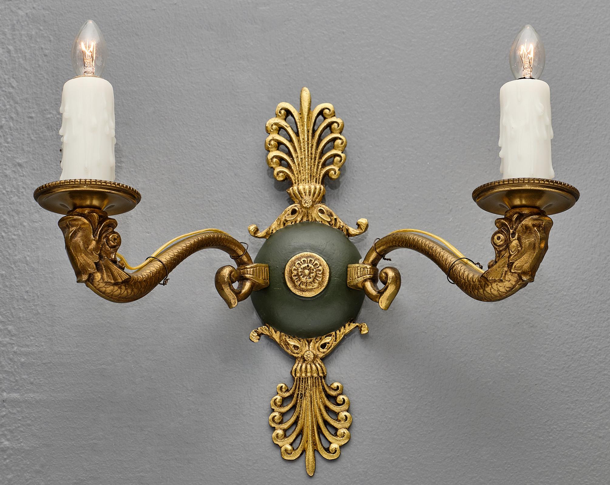 French antique Empire style sconces with acanthus leaf decor and bronze Roman dolphin arms. We love the dark green lacquer and the tole details. They have been newly wired to fit US standards.