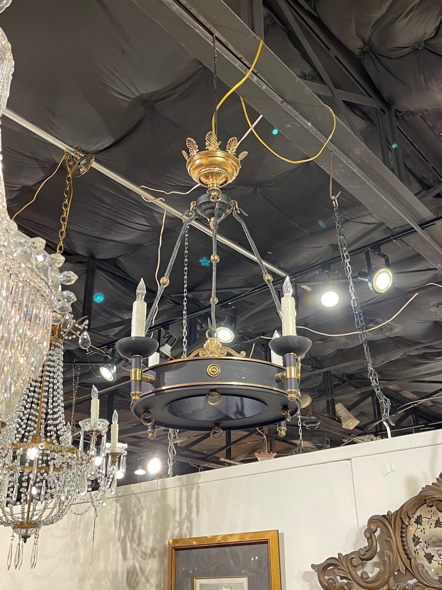 Very fine antique French Empire style tole and gilt bronze style chandelier with 4 lights. A classic style that creates and elegant look!