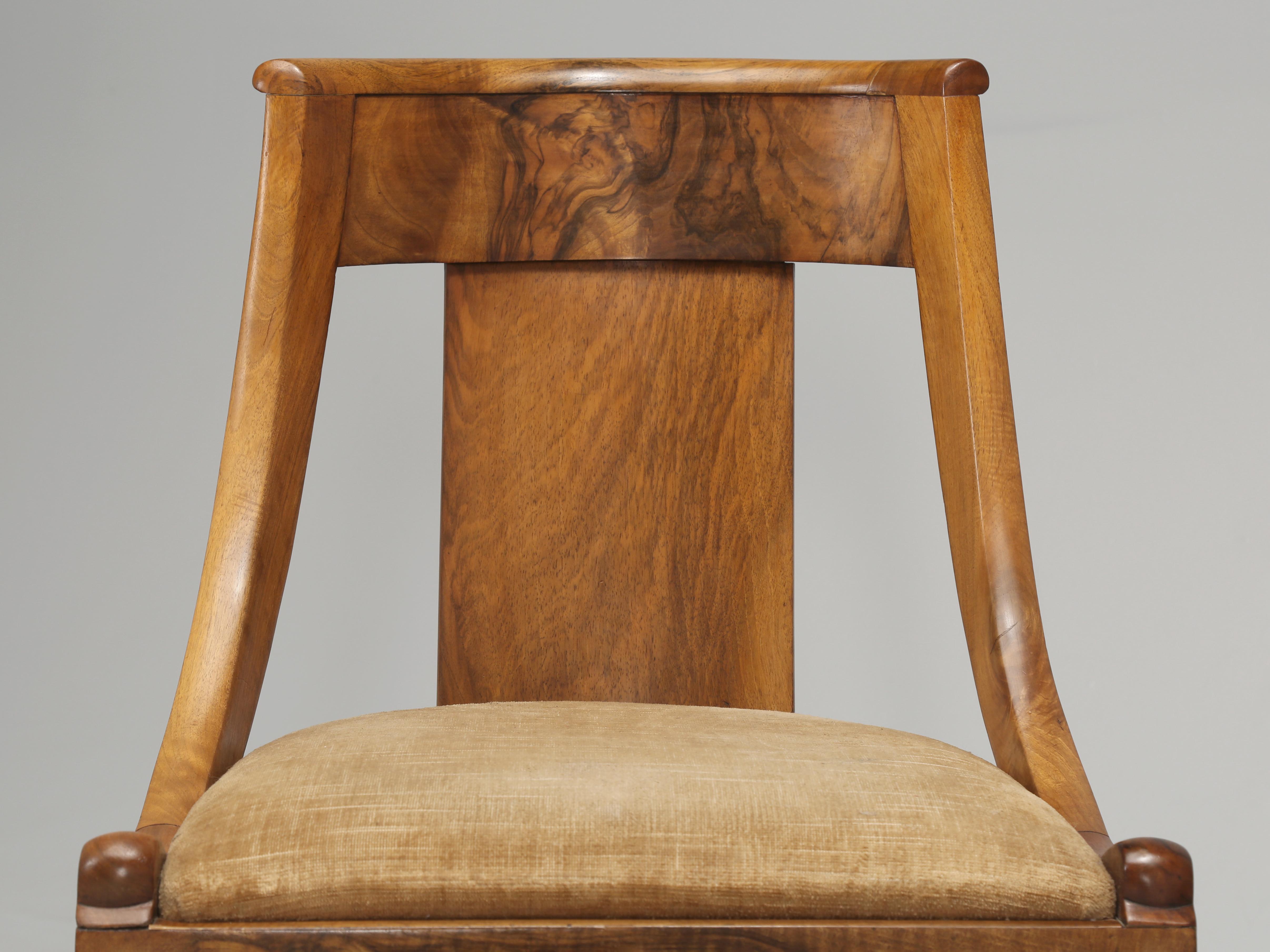 Magnificent pair of French Empire Style walnut barrel-back chairs, that was beautifully restored in France many years ago. The grain of the French walnut on this pair of barrel-back chairs is truly exquisite and quite rare to find French walnut this
