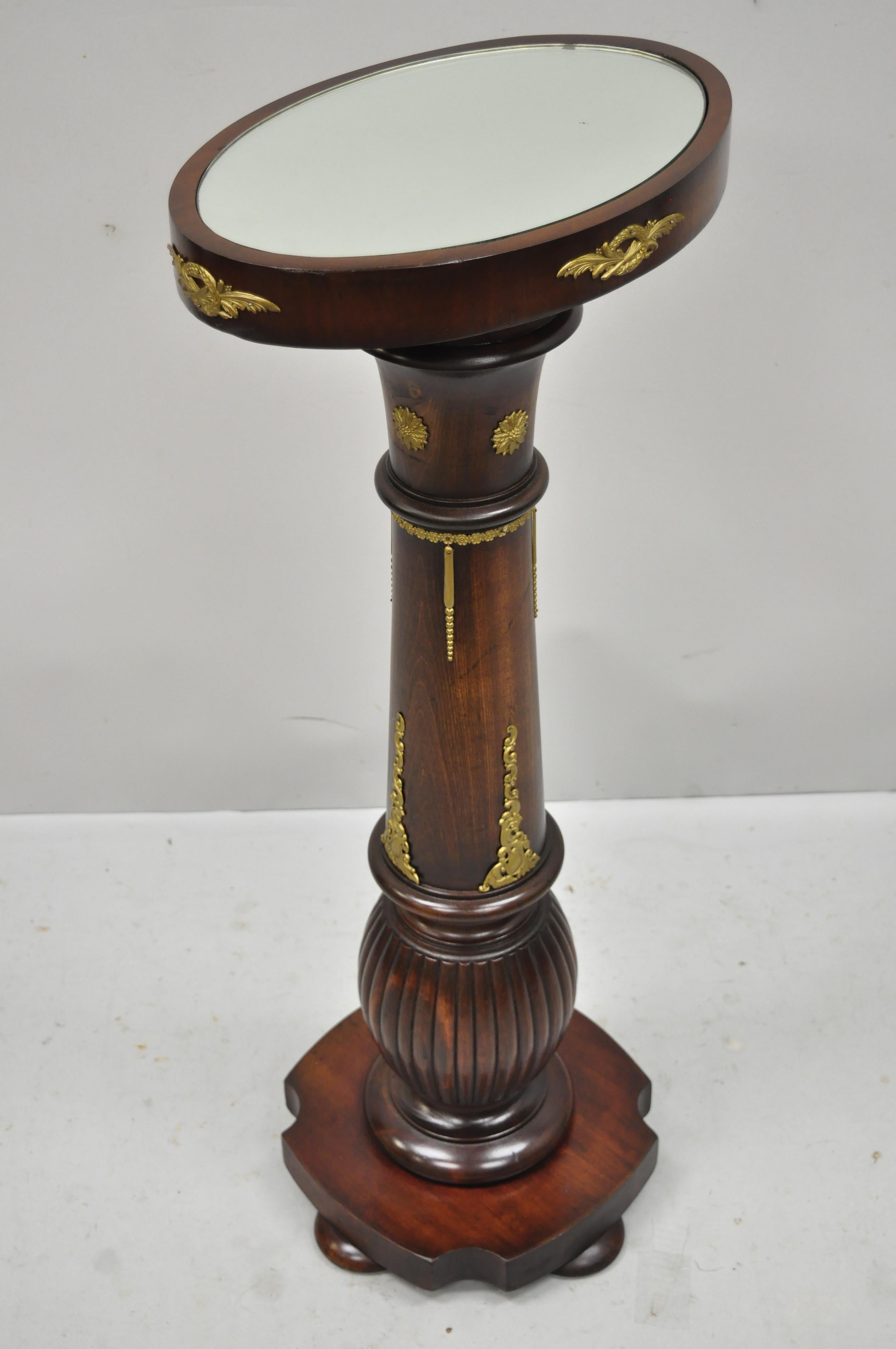 Antique French empire style wood column oval mirror top pedestal plant stand. Item features oval mirror top, brass ormolu, solid wood construction, nicely carved details, great style and form, circa early to mid-20th century. Measurements:
