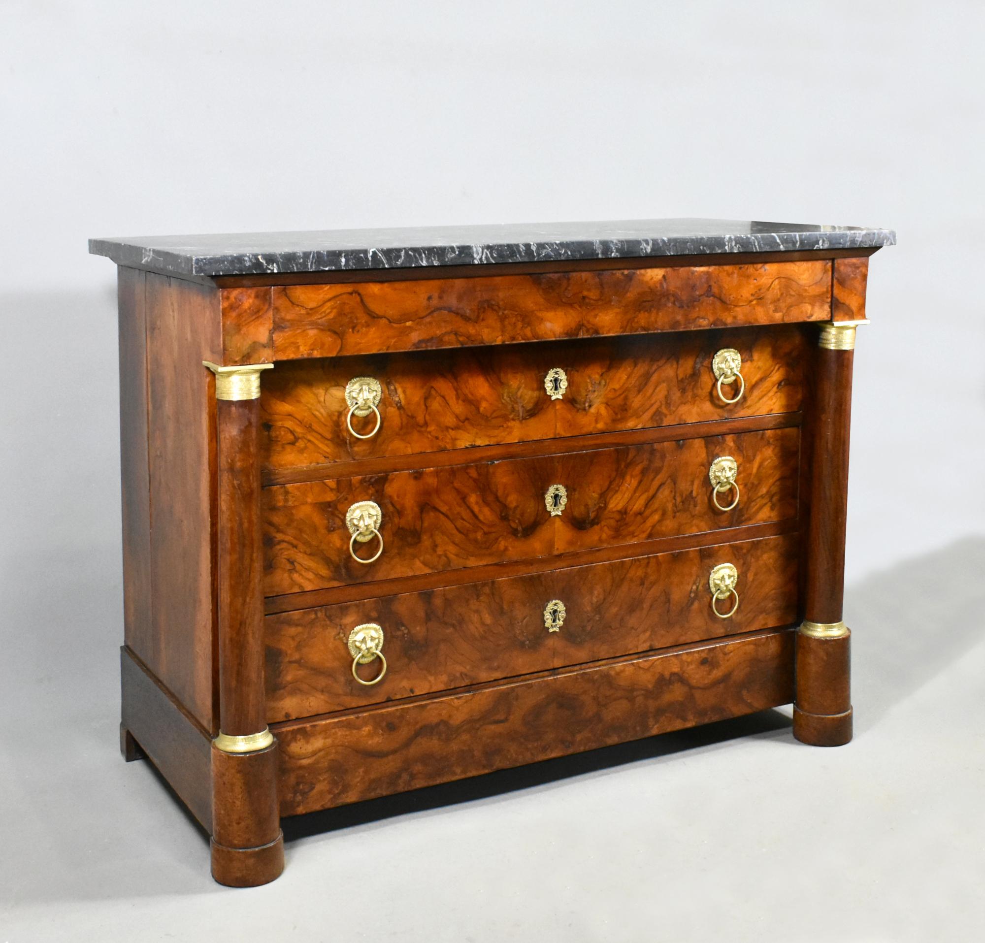 Antique French Empire Walnut Commode Early 19th Century 

This impressive Empire Commode features a beautiful black and white fossilised free standing marble top (25 mm thick) with a richly aged colour and patina. 

The four full-width drawers are