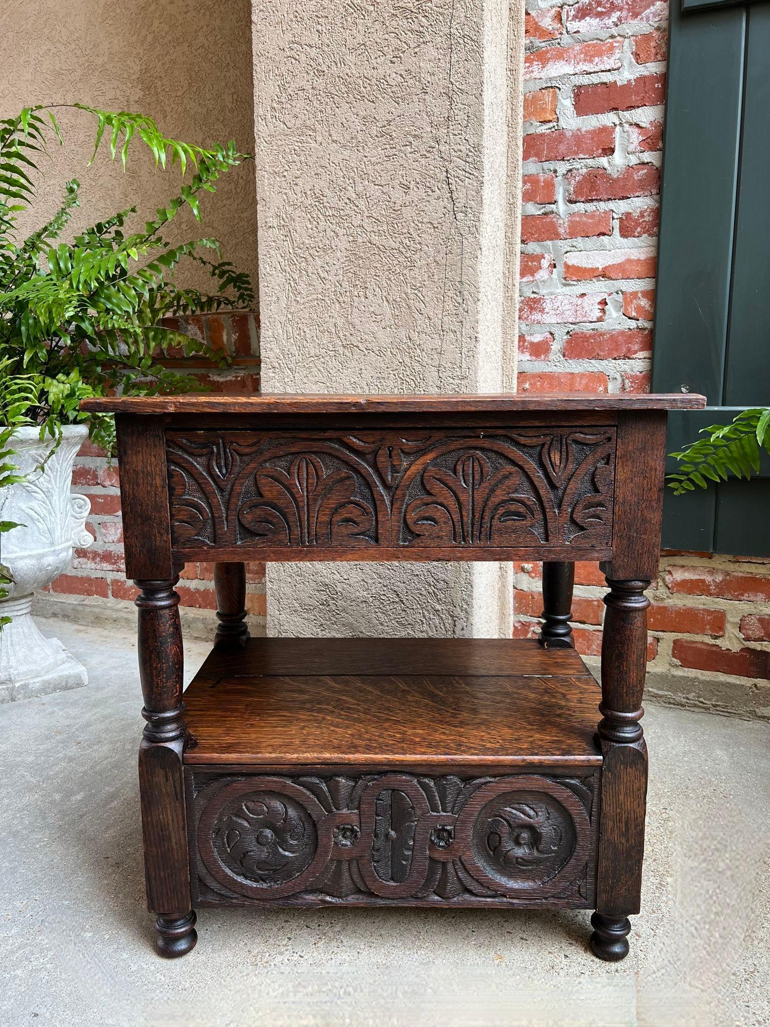 Antique French End Table Bible Box Carved Oak Two Tier Bench c1790.

Direct from France, a very old and highly carved small end table with a lower shelf having a lift top Bible box.
Skillfully hand carved in the late 18th century, the wide aprons