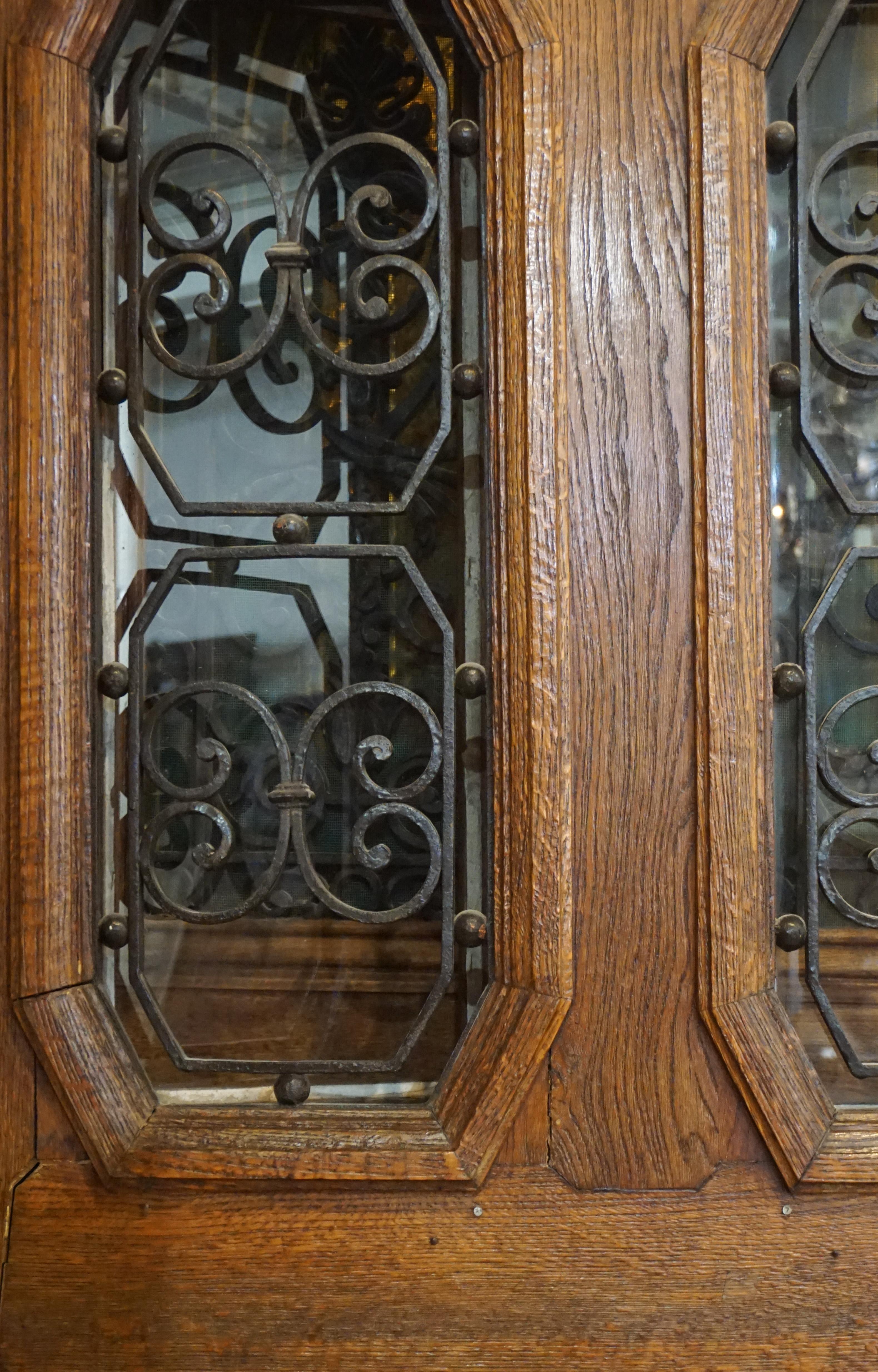 This oak entry door with twin windows and octagonal inset ironwork originates from France, circa 1890.

Measurements: 41.5'' W x 86'' H.