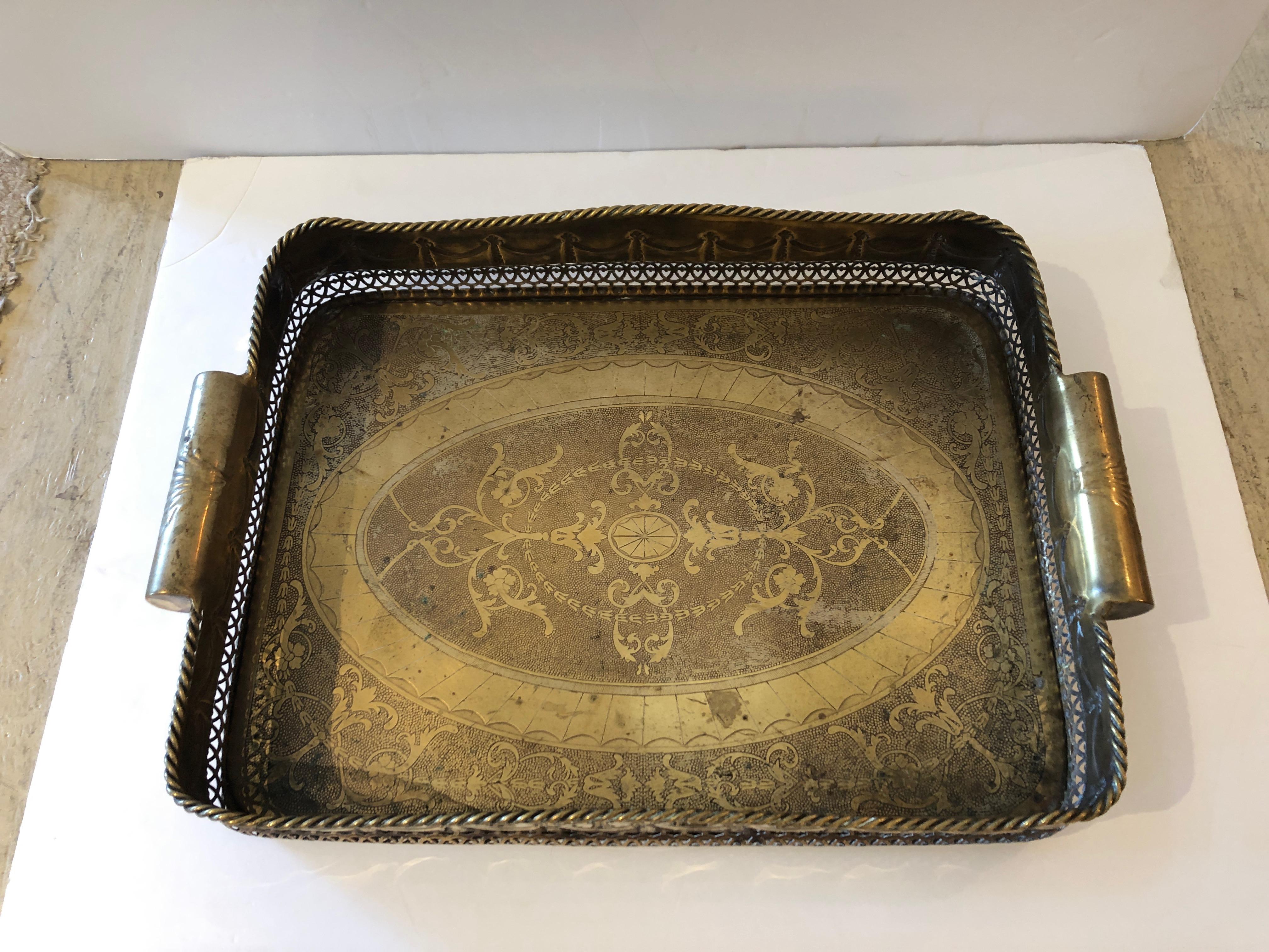 Very handsome brass tray with decorative etching and deep gallery with chunky handles at each end.