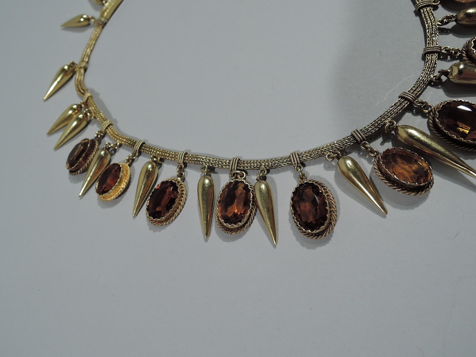 Etruscan Revival 18K gold and citrine necklace, ca 1870. Fringe-style with egg-and-dart pendants in form of alternating collet-set citrines and gold. A beautiful example of the archaeological vogue. Signed MB in lozenge and French hallmark on clasp