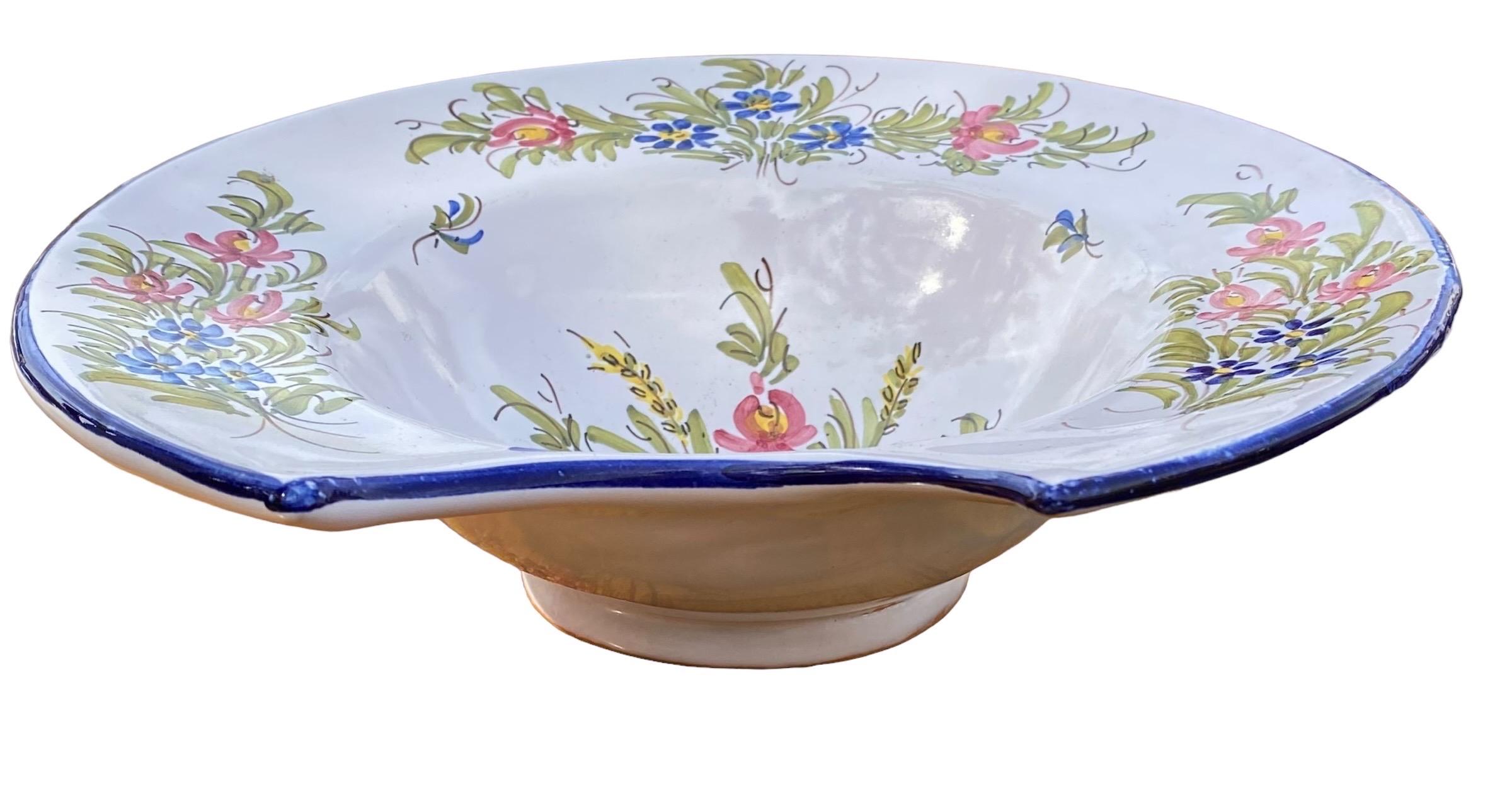 An iconic piece of French history Is this antique French Faience plat a barbe (Barber's Bowl) created by bolosunes masters in Samadet, a commune in Landes, in southwestern France, having beautifully hand painted decoration in provincial colors of