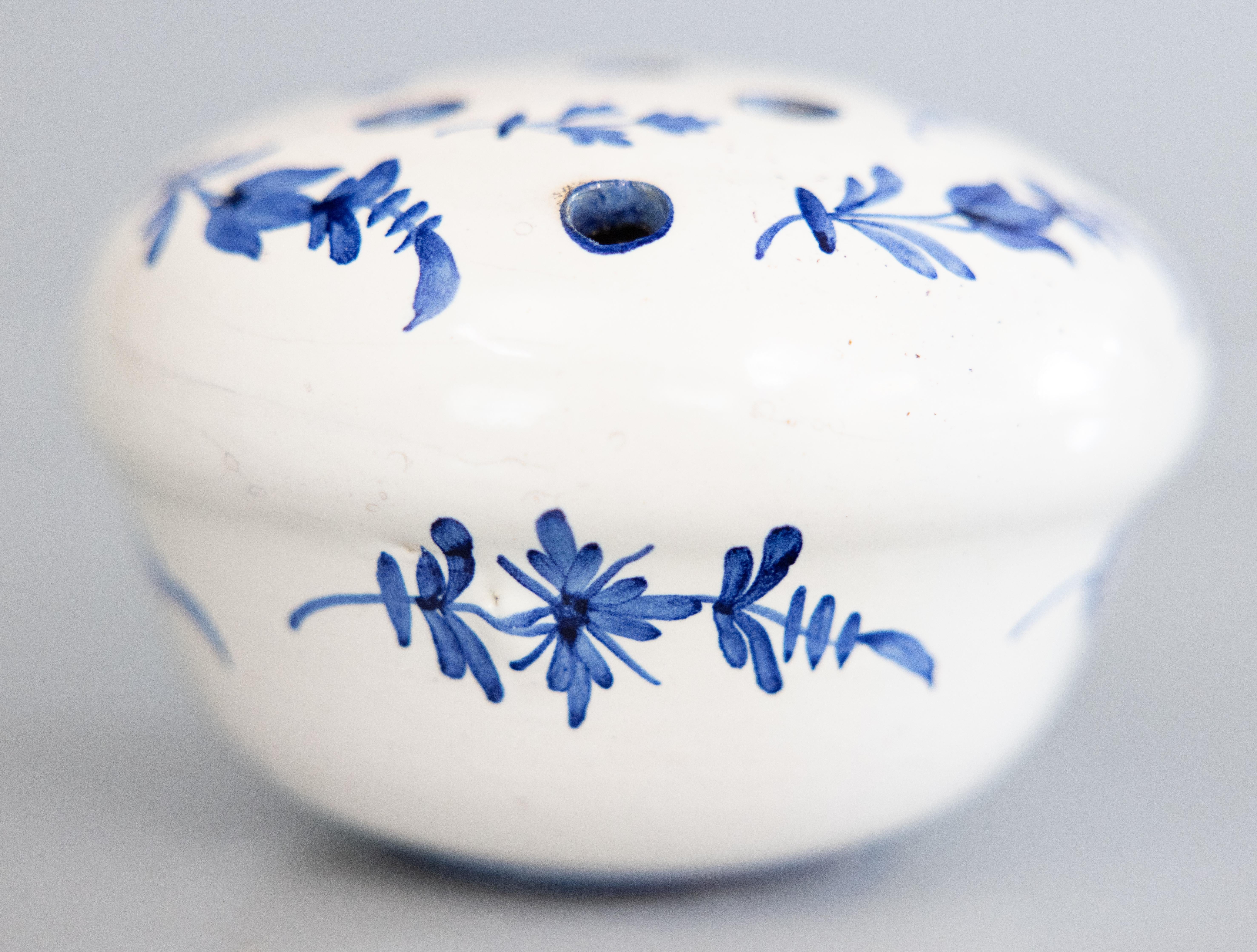 A fine antique French faience hand molded flower frog vase or rose bowl, circa 1900. This charming flower frog has a hand painted floral design in vibrant cobalt blue and white. It displays beautifully and would be lovely with your favorite