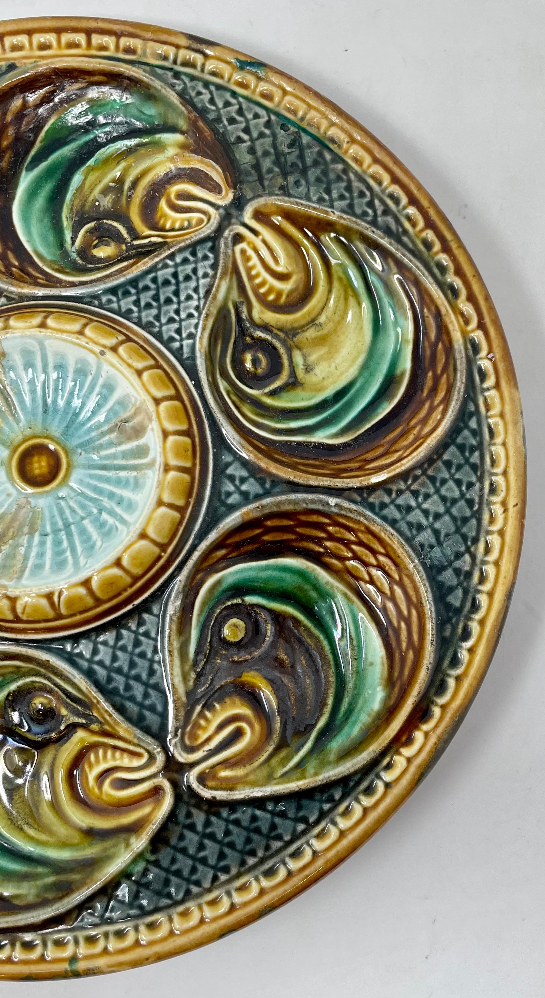 Antique French Faience Palissy Ware porcelain fish-head oyster plate, circa 1890.