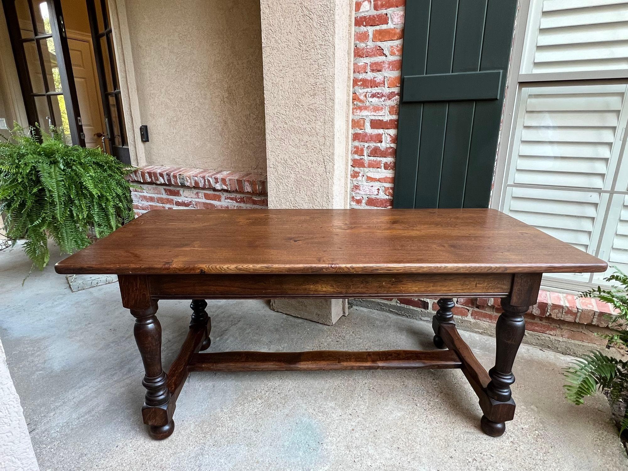 Antique French farm table dining library desk carved Oak Farmhouse 6 ft.

Direct from France, a gorgeous (and quite heavy) antique French oak dining table or conference/library table in a large 71” length!
These tables are one of our most