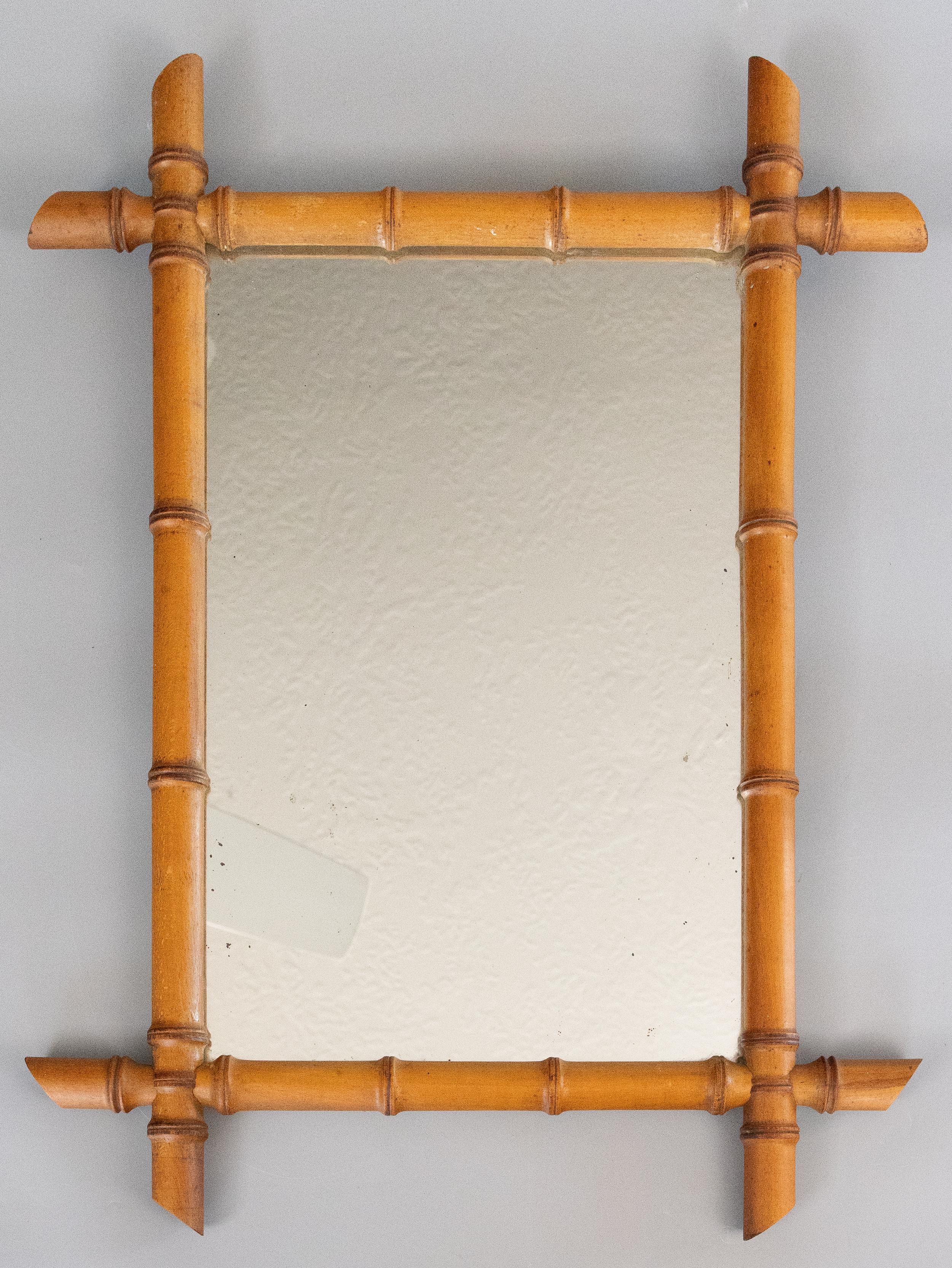 A large superb antique French mirror hand carved to resemble bamboo, circa 1900. It retains the original mirror glass and the wood has the lovely original surface and patina. Add French style to any room with this fabulous mirror.

frame: 20.25