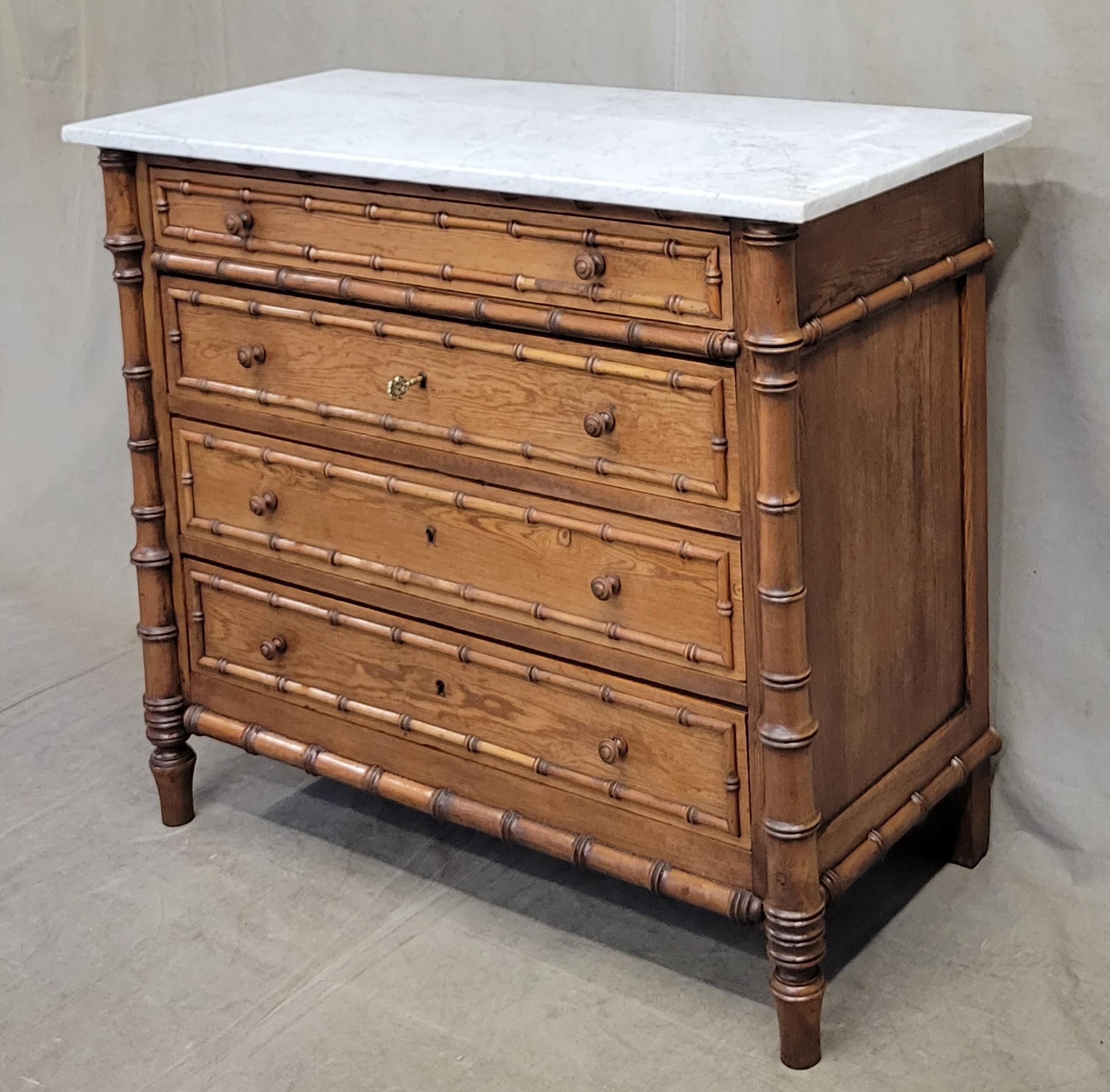 An absolutely beautiful antique French faux bamboo pitch pine and cherry dresser chest of drawers with old Carrera marble top and matching mirror. Original turned wood knobs are intact. Drawer fronts and side panels are solid pitch pine; posts and