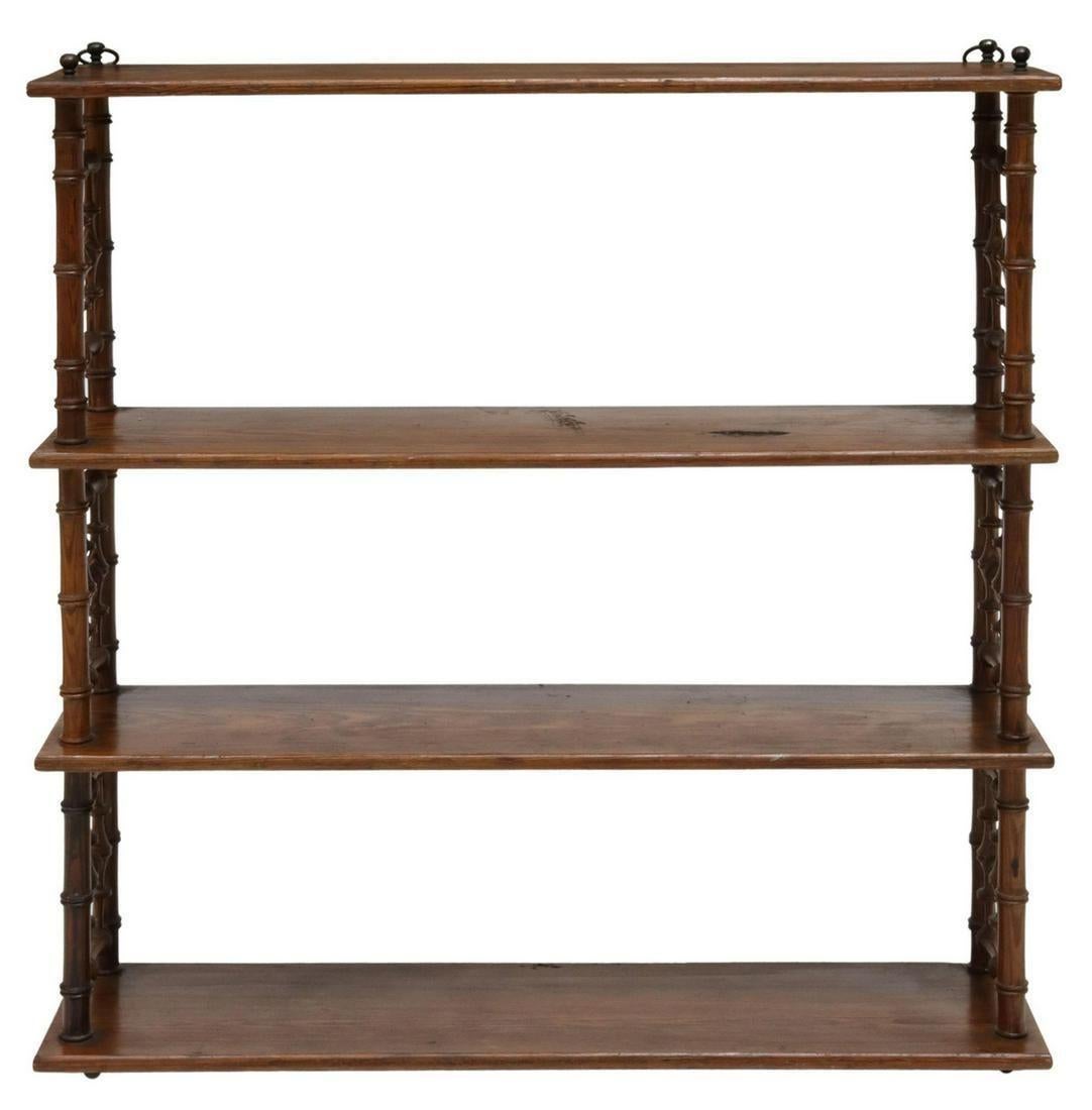 Antique French Provincial faux bamboo wall-mounted etagere, early 20th c. This wall mounted display or book shelf features four open shelves (made of pine), spindled side panels, turned supports, top shelf with metal rings for hanging,

Dimensions
