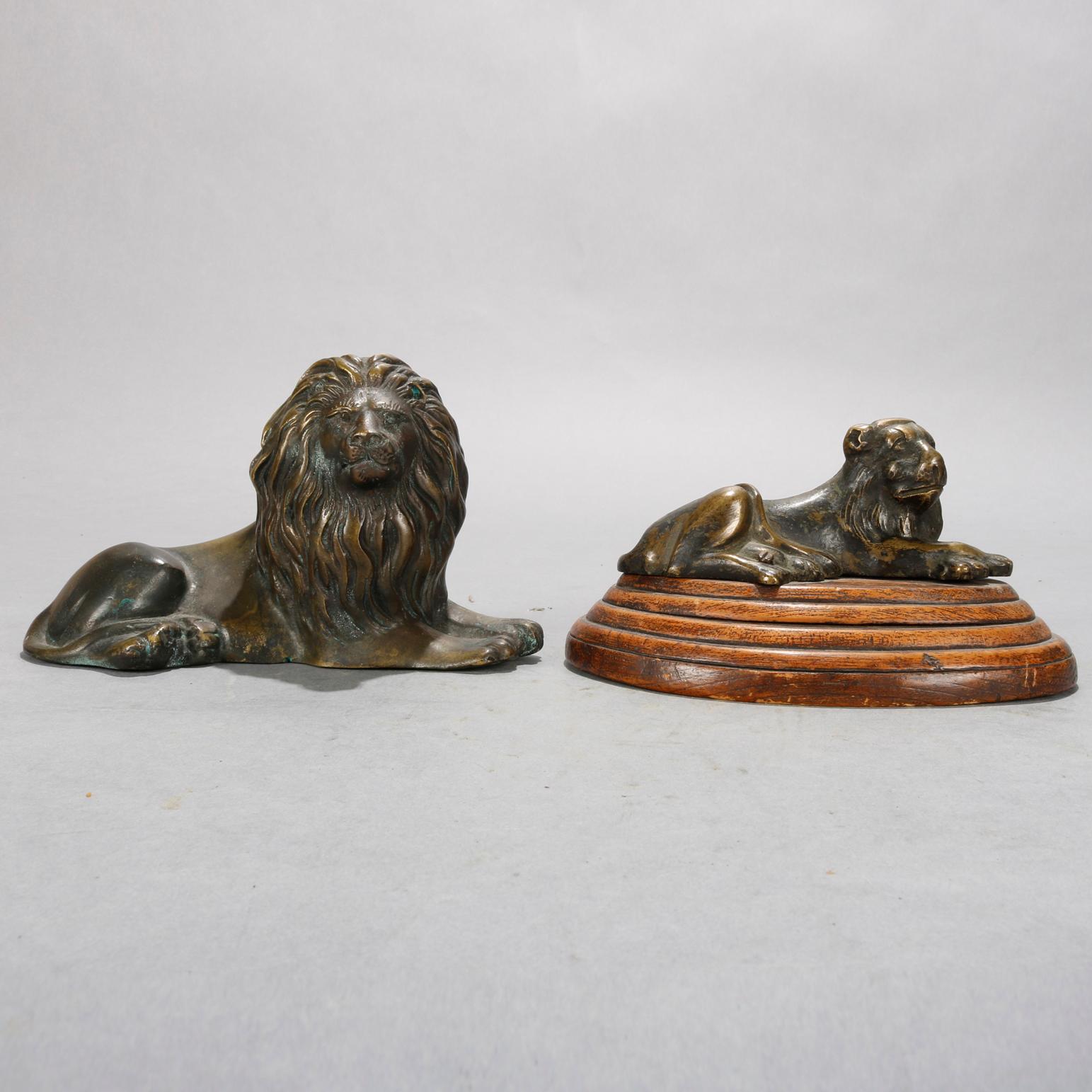 An antique set of French figural sculptures depict recumbent lion and lioness with lioness seated on stepped wood base, circa 1890.

Measures: Male: 4.25