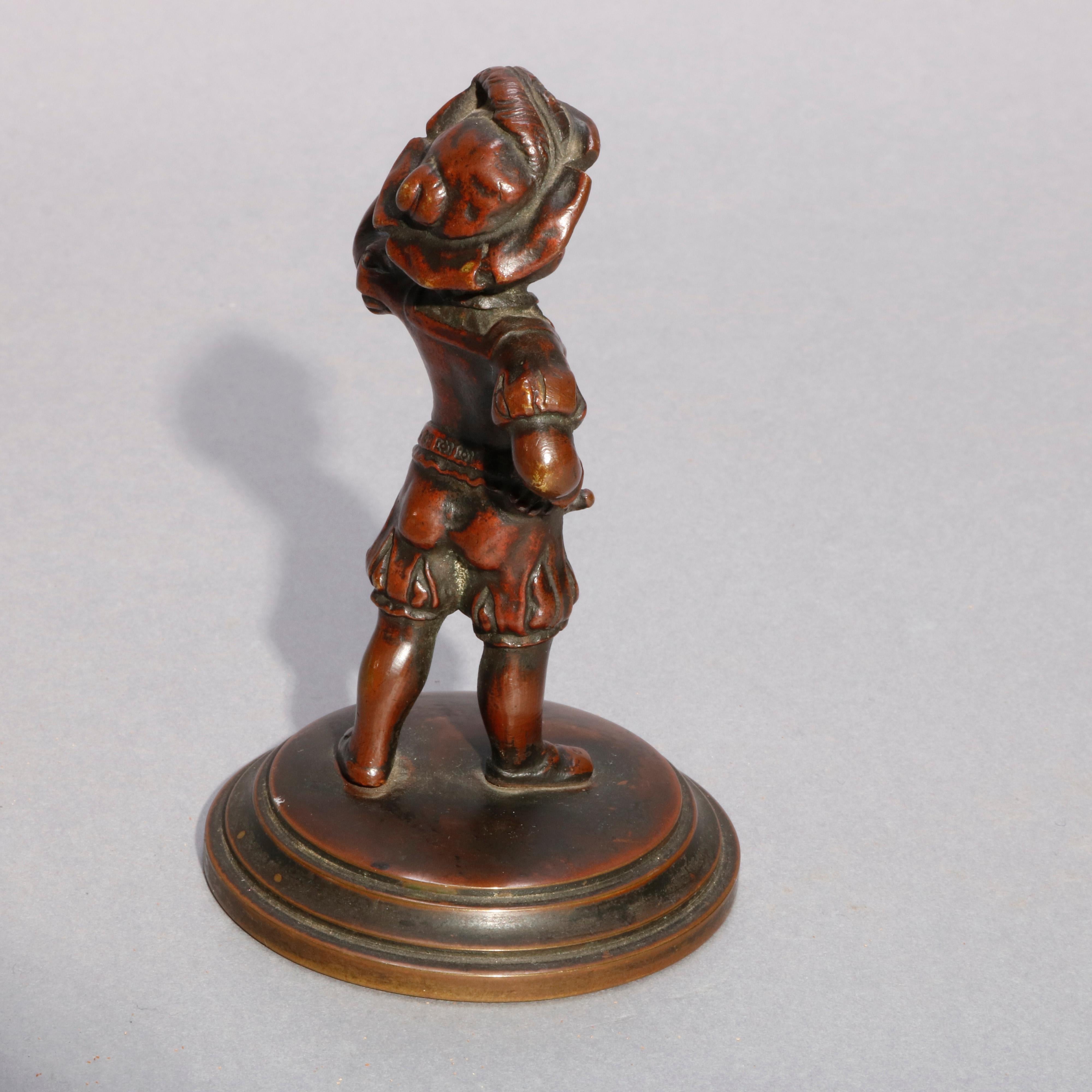 An antique French cast bronze figural child portrait sculpture depicts young boy raising cup, raised 
 on stepped round base, circa 1890.

Measures: 5