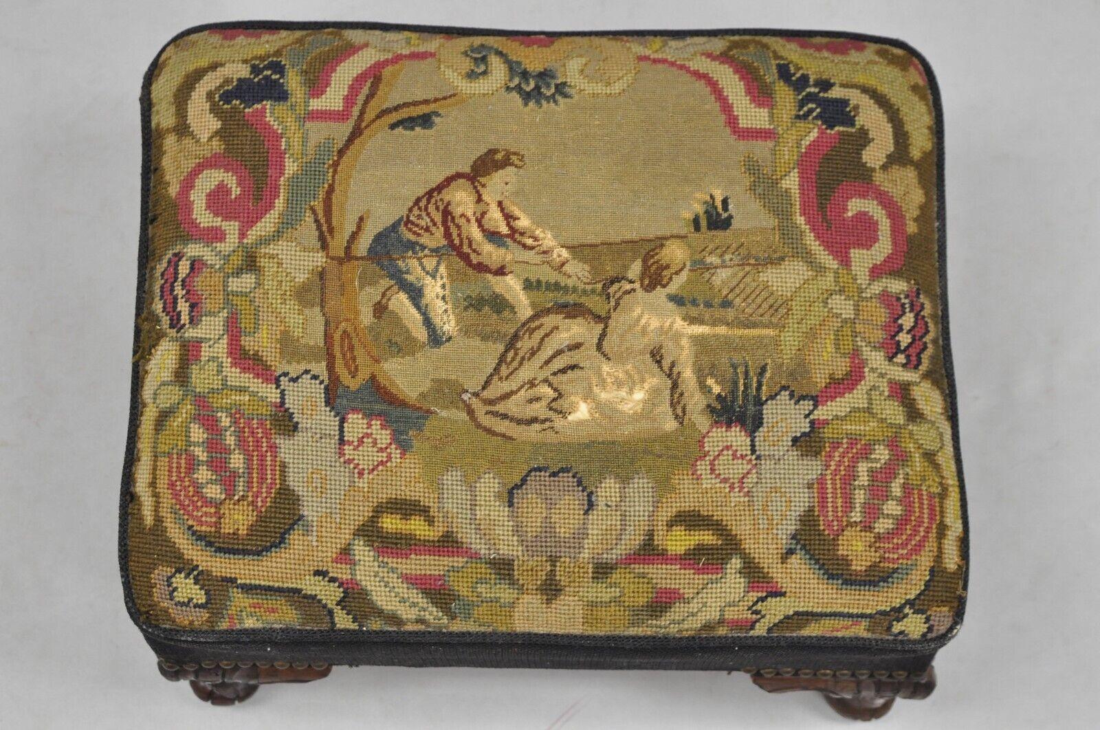 Antique French Figural Needlepoint Box Footstool Ottoman on Mahogany Legs. Item featured believed to be a vintage custom made item using Antique French needlepoint tapestry and vintage carved mahogany legs on a custom box wooden frame. Very well