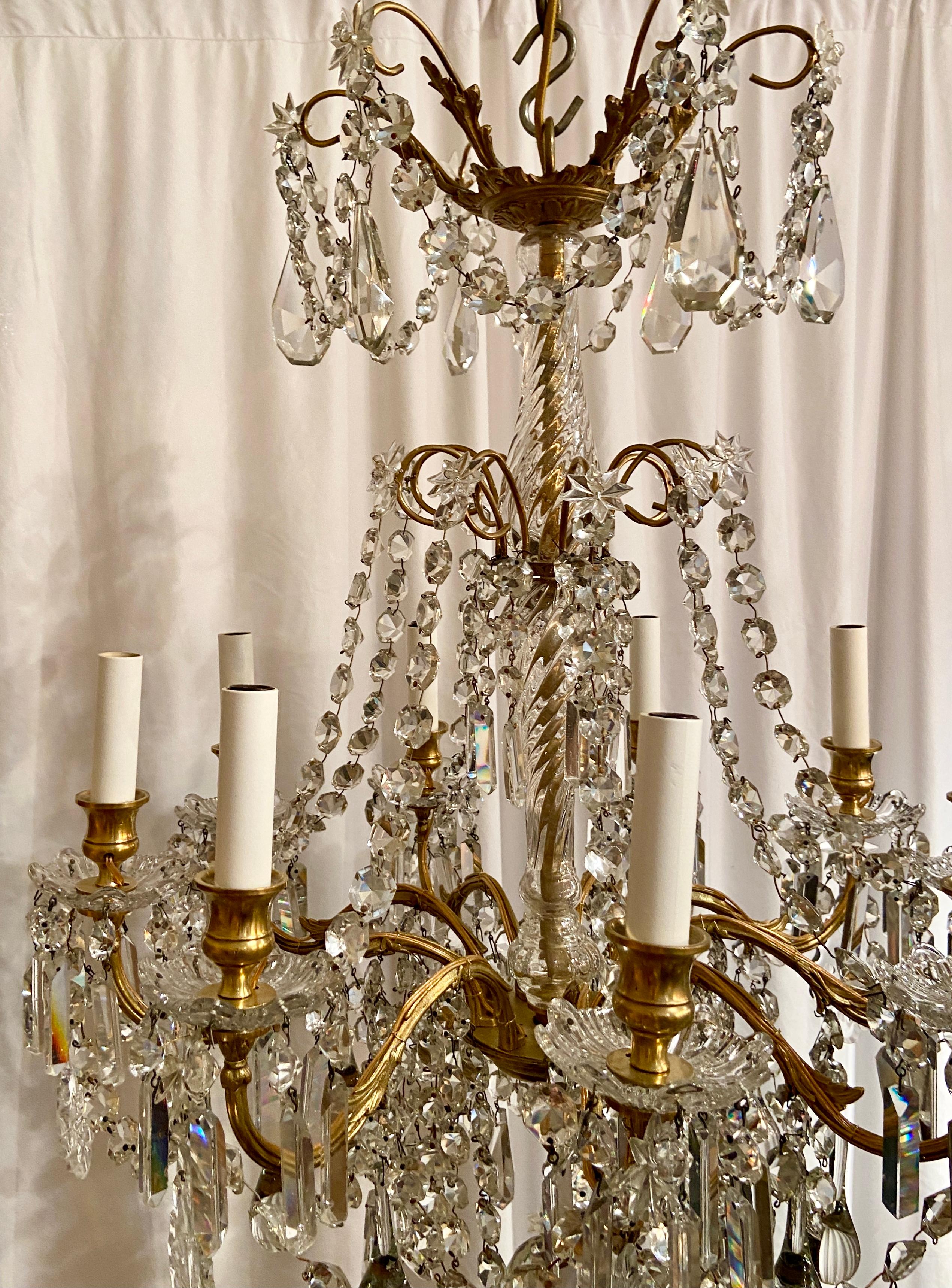Antique French fine crystal and gold bronze 9-light chandelier.
