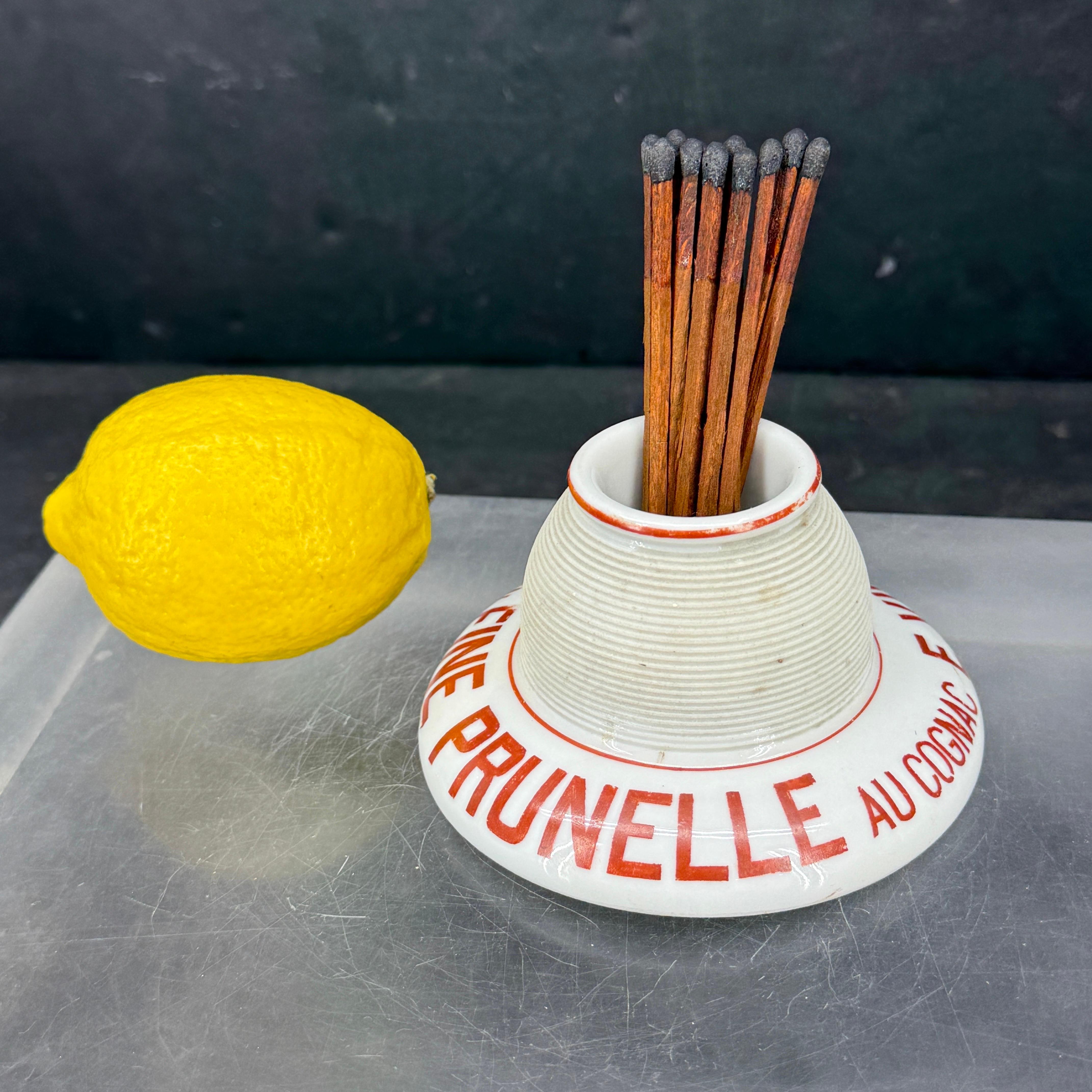 As found in at a French market, this classic red and white matchstick striker or 