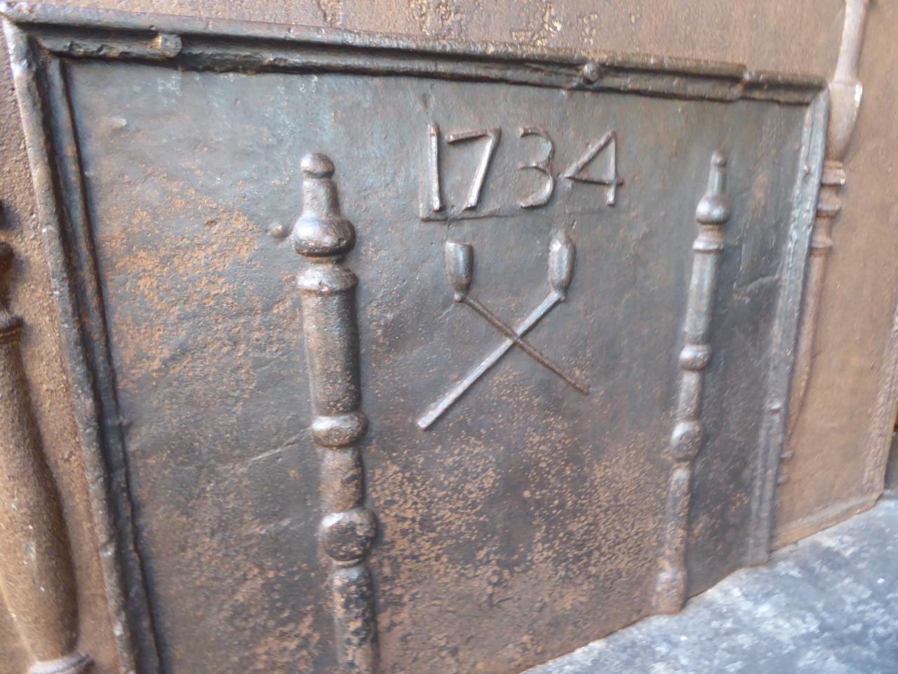 Iron Antique French Fireback with Pillars and Pipes, Dated 1734