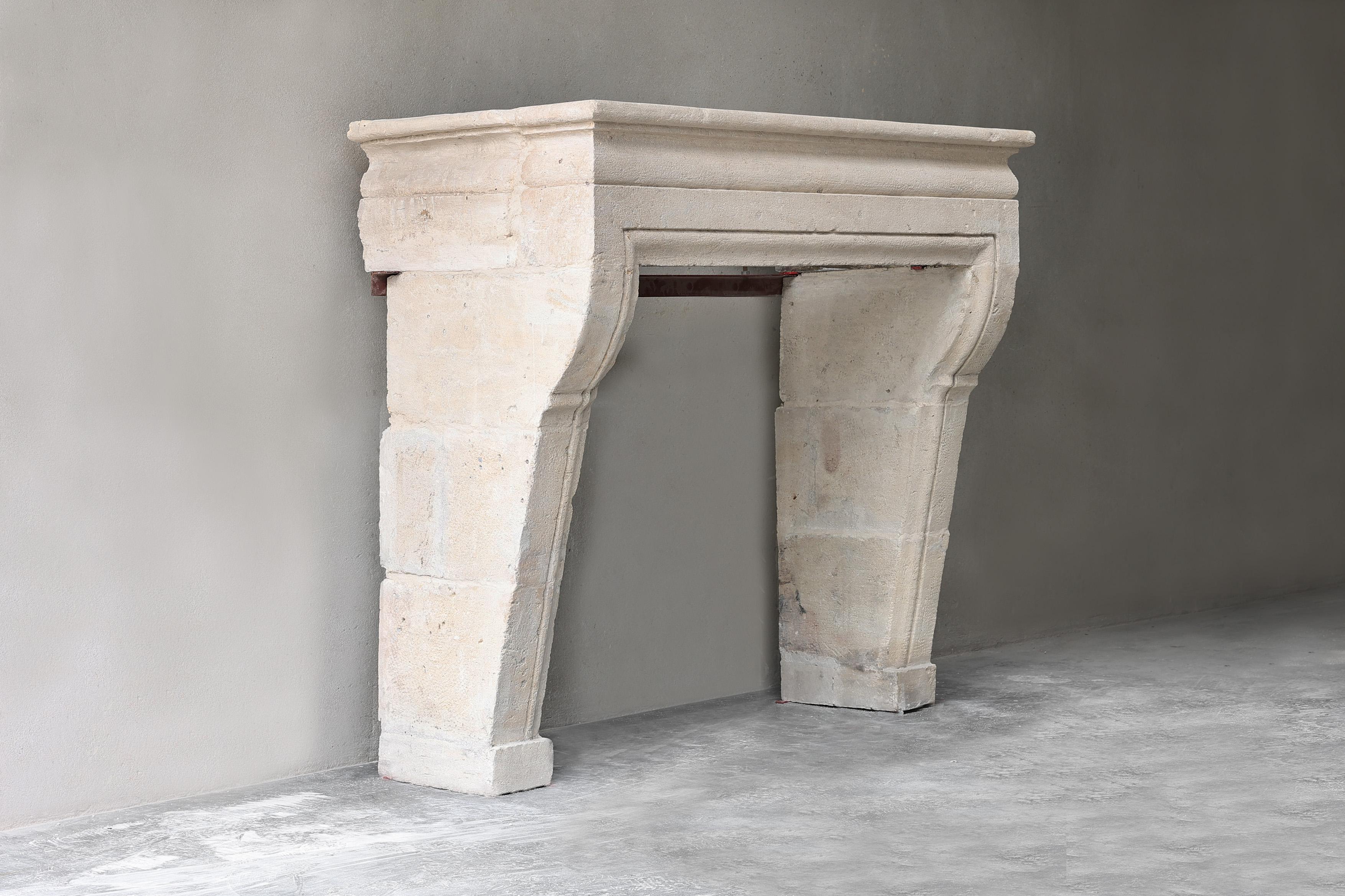 Beautiful antique mantelpiece with its rustic appearance! This 19th century mantle is in the Campagnarde style and made of French limestone. A very beautiful mantelpiece with a warm color nuance! 