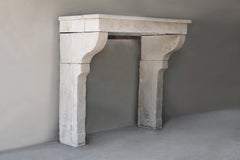 Antique rustic fireplace of french limestone, 19th century in country style