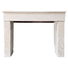 Antique fireplace of french limestone, 19th century, rustic appearance