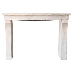 Antique mantle surround of limestone, 19th century in style of Campagnarde