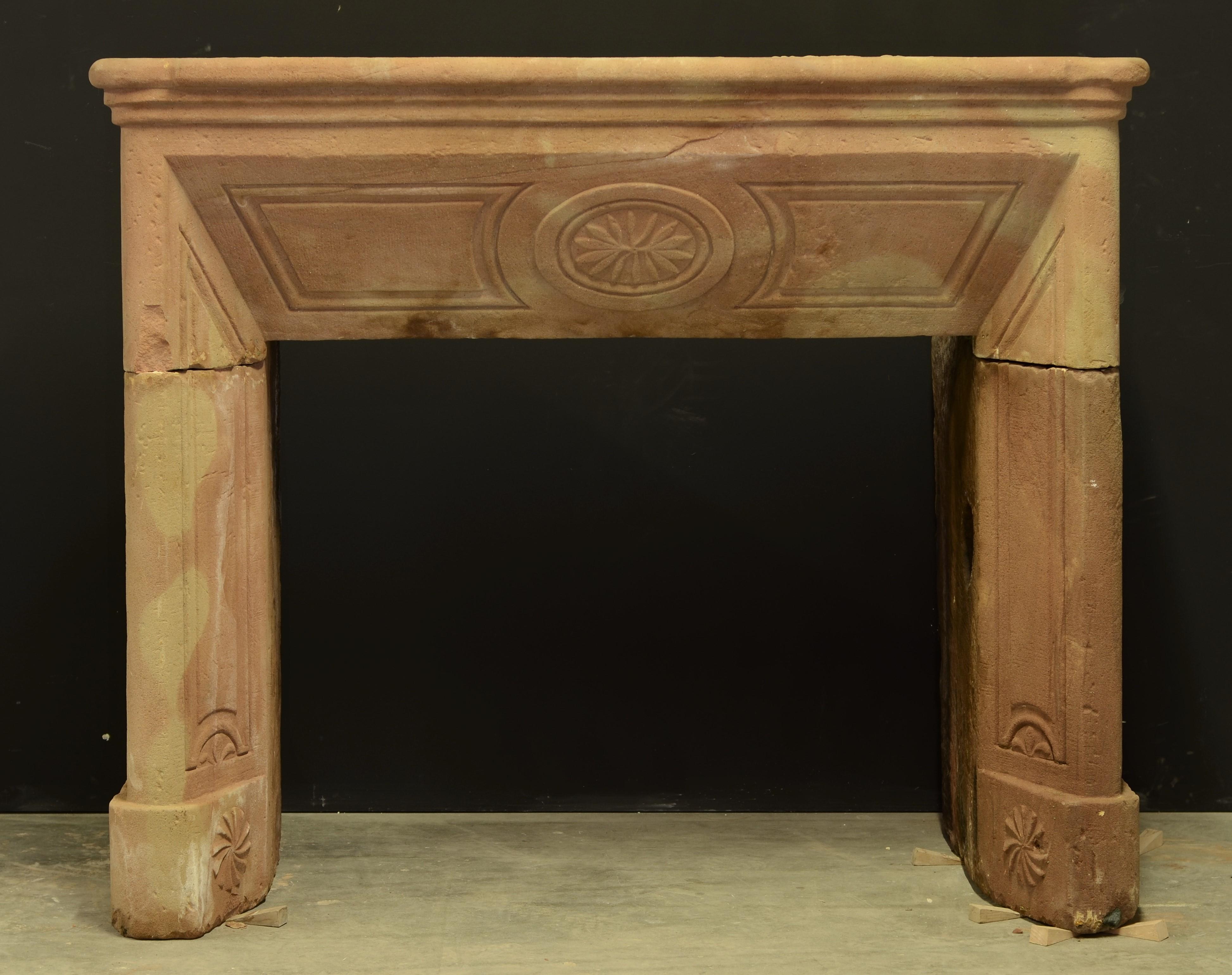 Very nice and subtle pinkish French Louis XVI fireplace mantel.
The mantel is made from Sandstone from the “Massif de Vosges” called Grès Rose, pink sandstone.
One of its unique characters it that the color changes during the day and the way it is