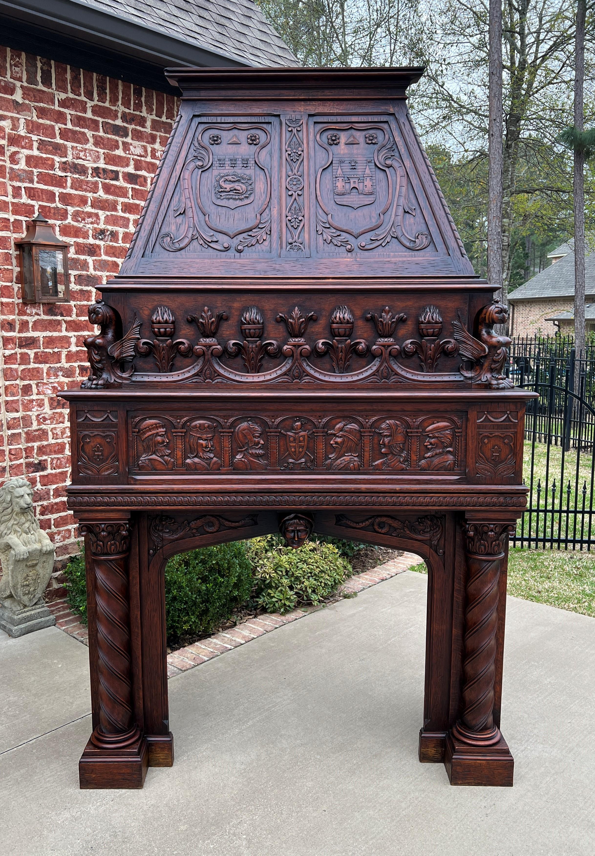 Superb antique large French fireplace mantel surround with upper hood ~~renaissance revival~~highly carved oak~~circa 1880s
This handsome statement piece will add charm and character to your home or castle~~the best of the best~~masterfully carved