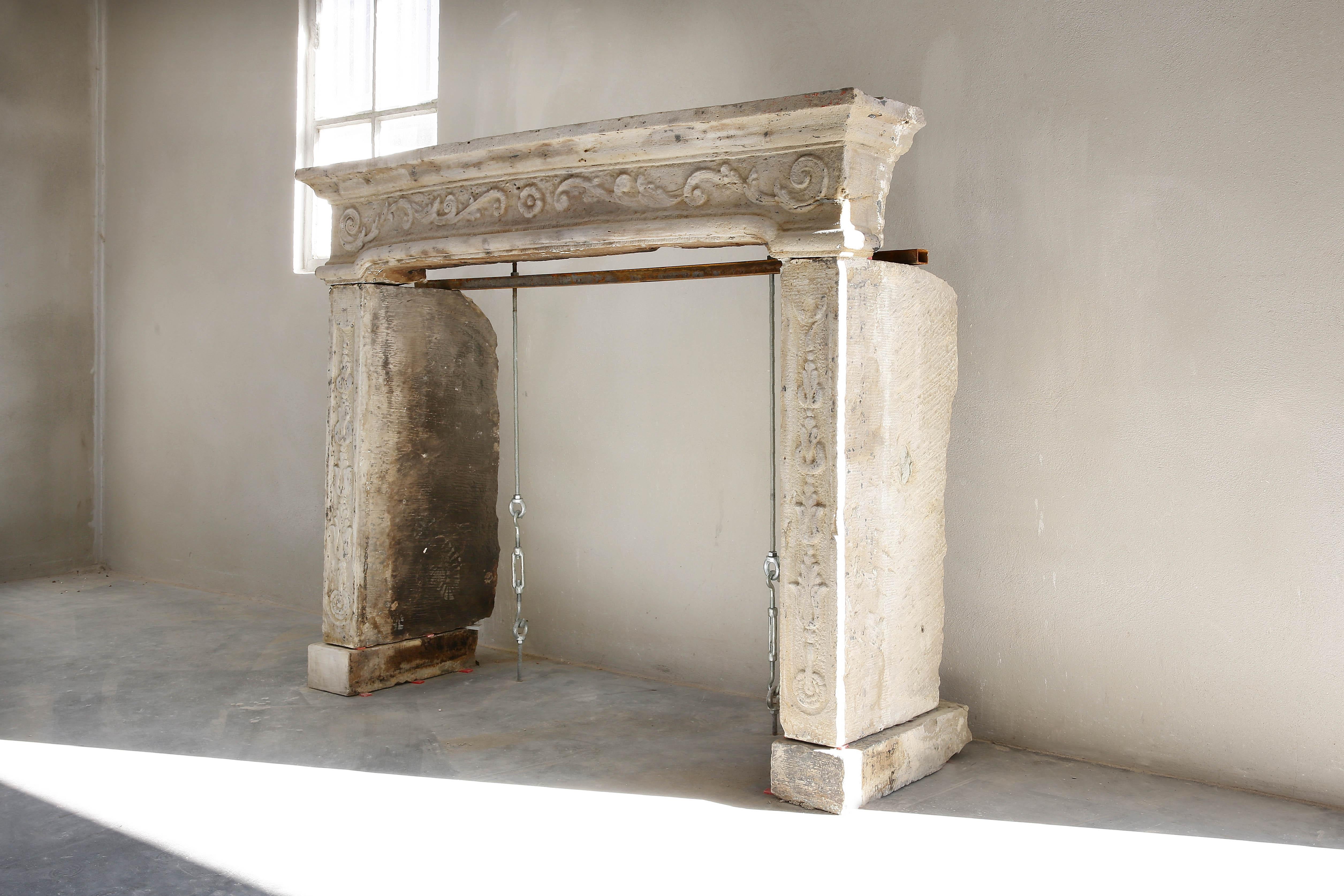 Rare exclusive antique fireplace made of French limestone. The beautiful shape and ornaments in the front part of the fireplace make this chimney very special! The mantelpiece dates from the 19th century and is in the style of Louis XIV.