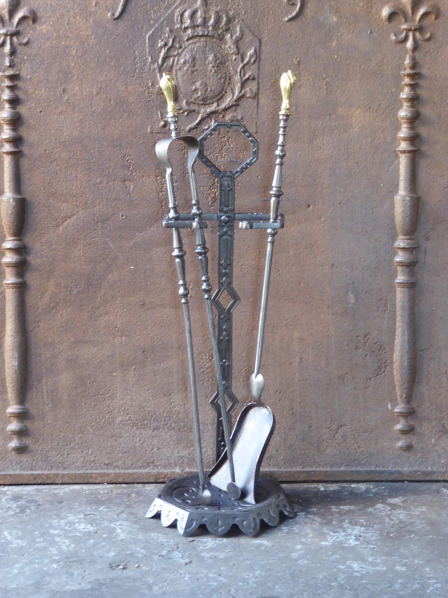 Late 19th or early 20th century French Napoleon III fireplace tool set. The toolset consists of a stand and two fire irons. Made of wrought iron, brass and cast iron. It is in a good condition and is fully functional.
 
 





 