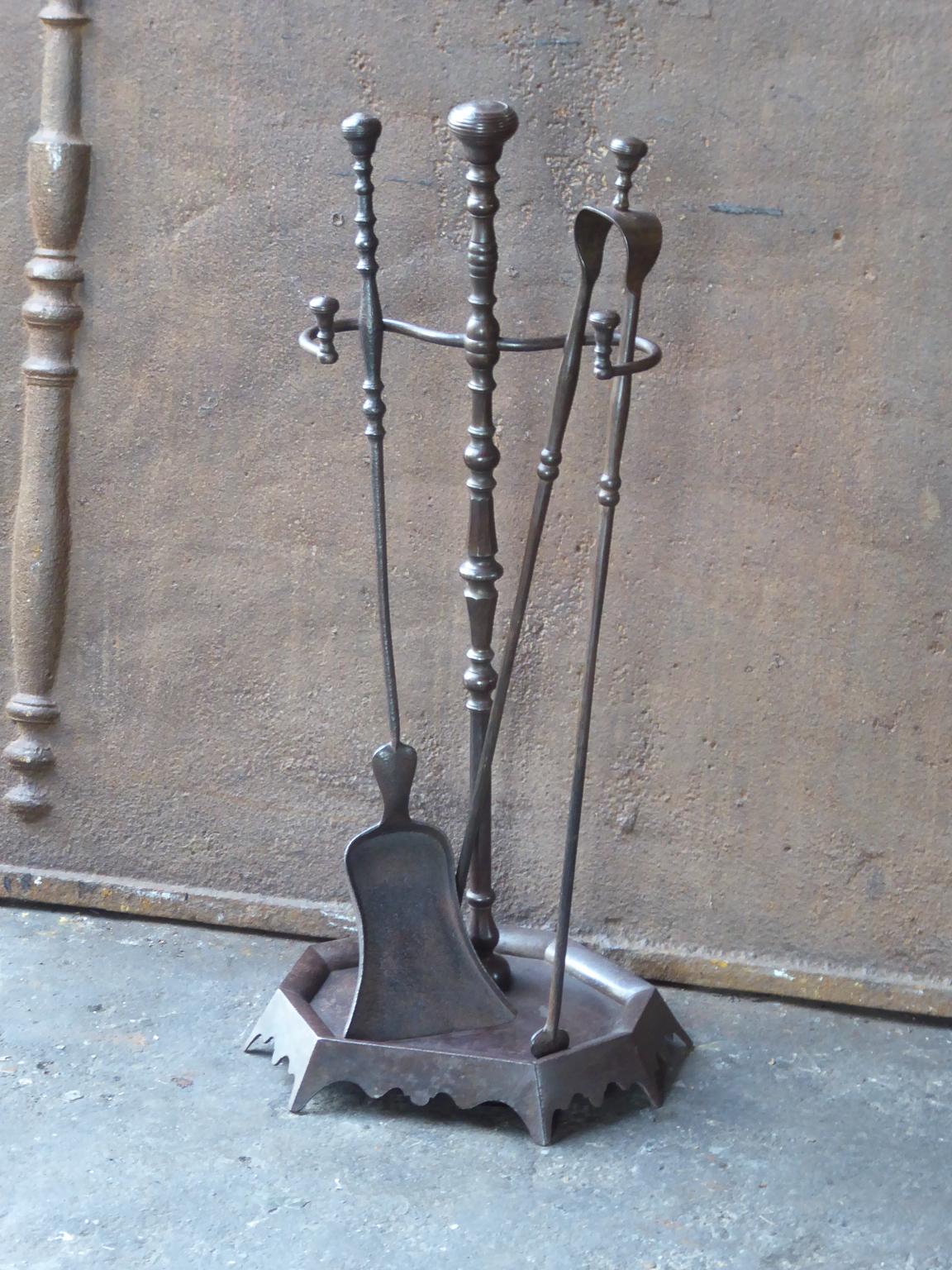 19th century French Napoleon III fireplace tool set, fire irons made of wrought iron. The toolset consists of a stand and two fire irons.







    