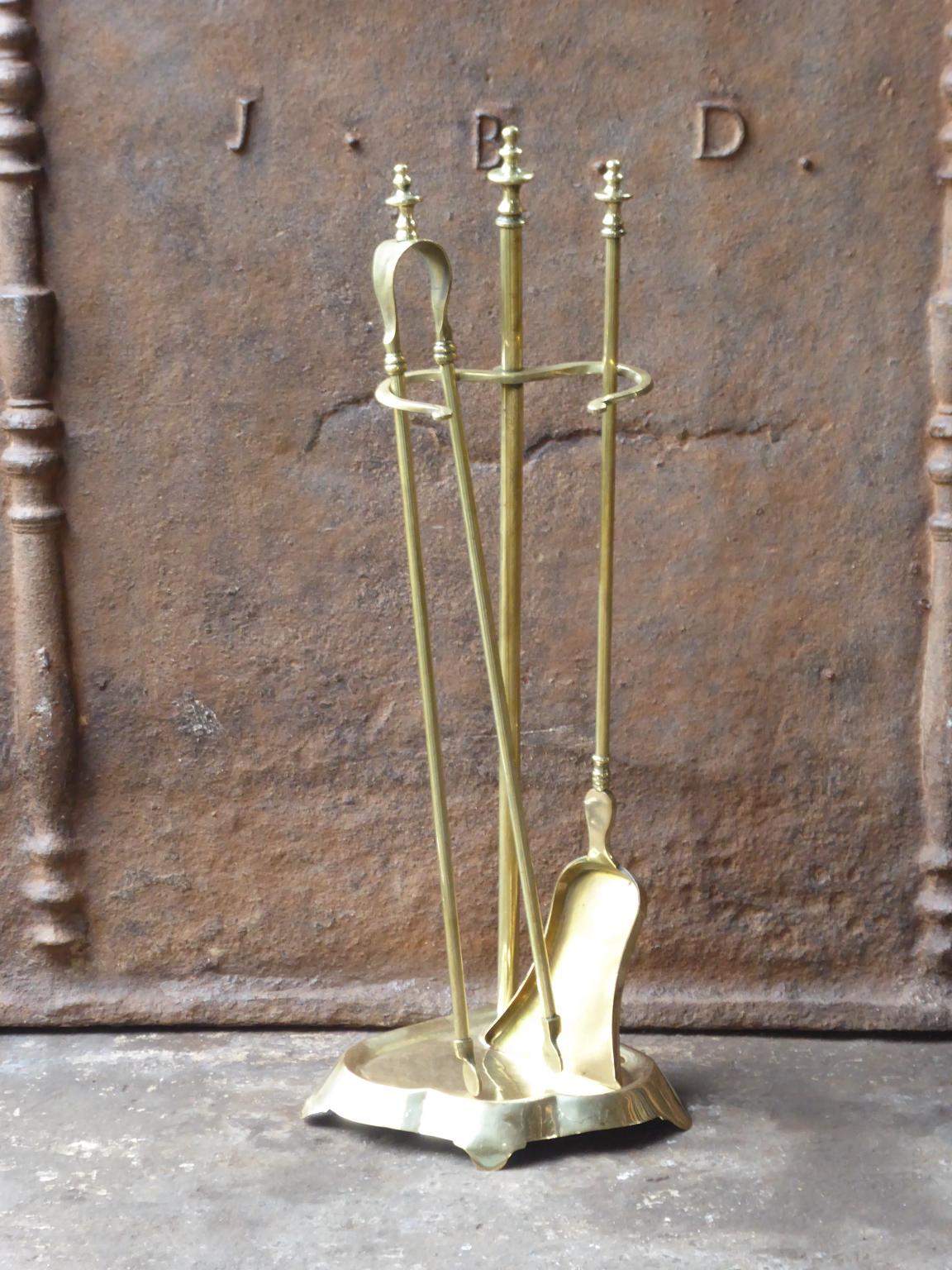 19th century French Napoleon III fireplace tool set. The toolset consists of a stand and two fire irons all made of polished brass. It is in a good condition and is fully functional.
 
 





 