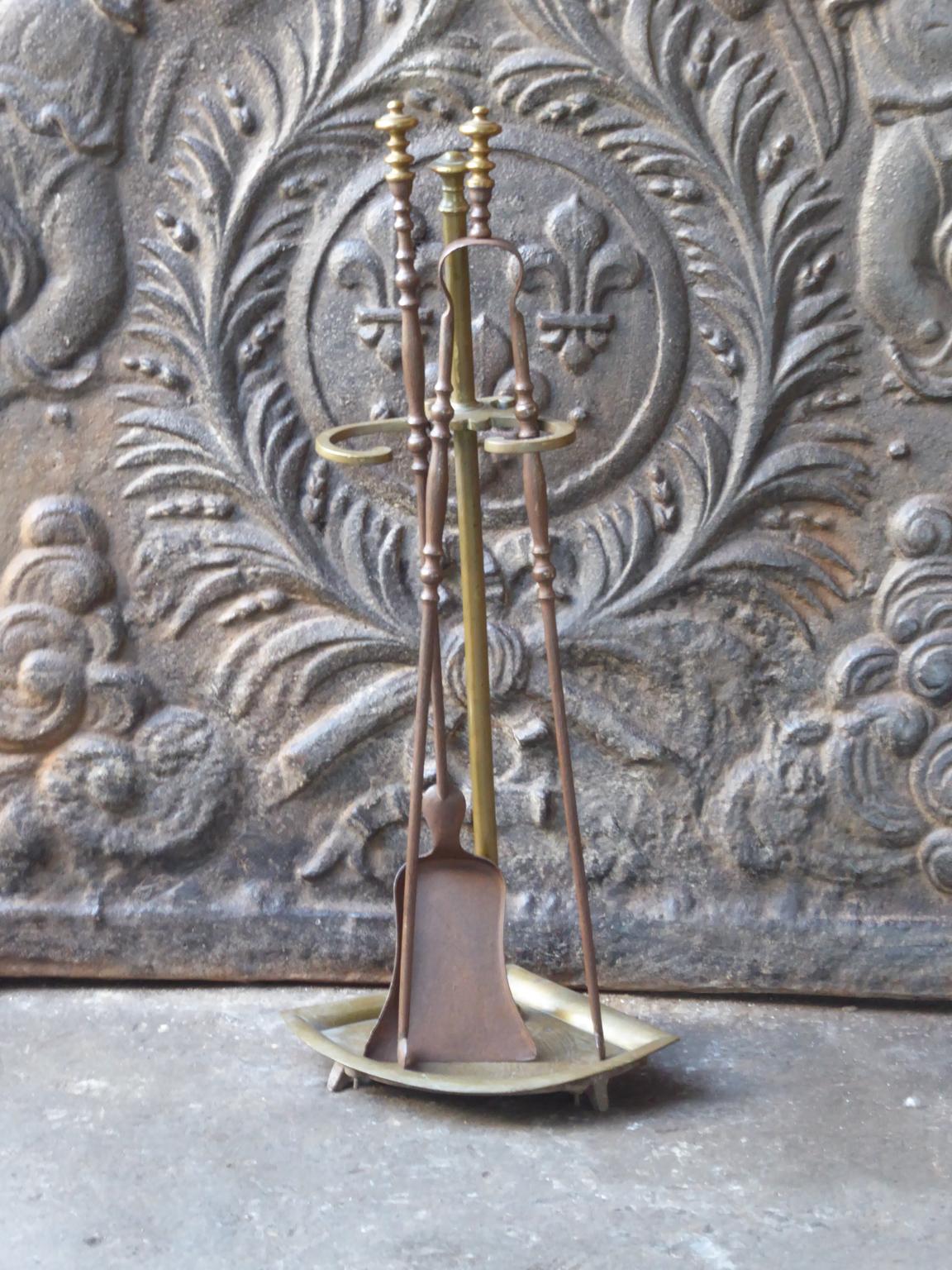 19th century French Napoleon III fireplace tool set. The toolset consists of a stand and two fire irons. All are made of wrought iron and brass. It is in a good condition and is fully functional.
 
 





   